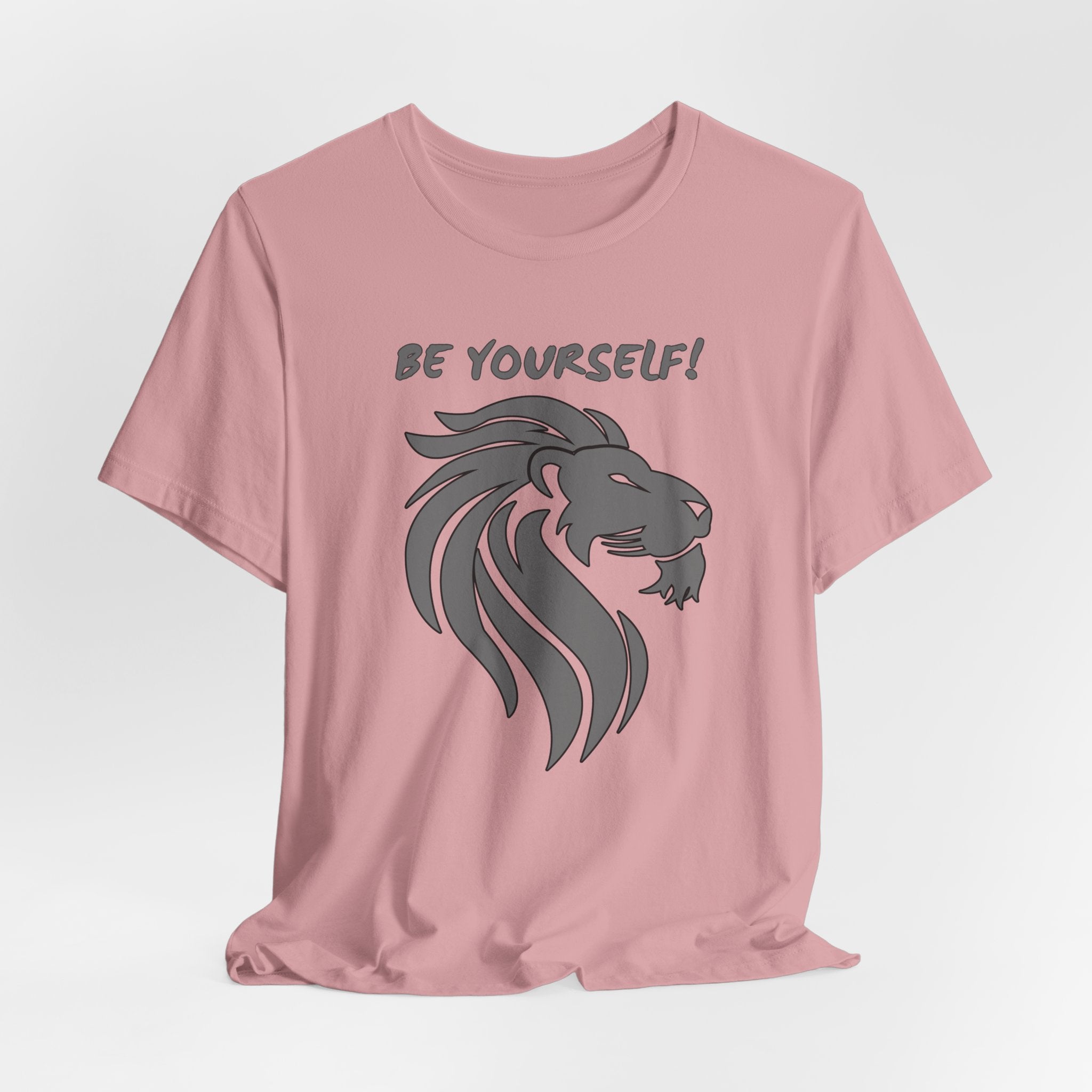 Orchid pink t-shirt with a lion graphic and 'BE YOURSELF!' text on a light gray background