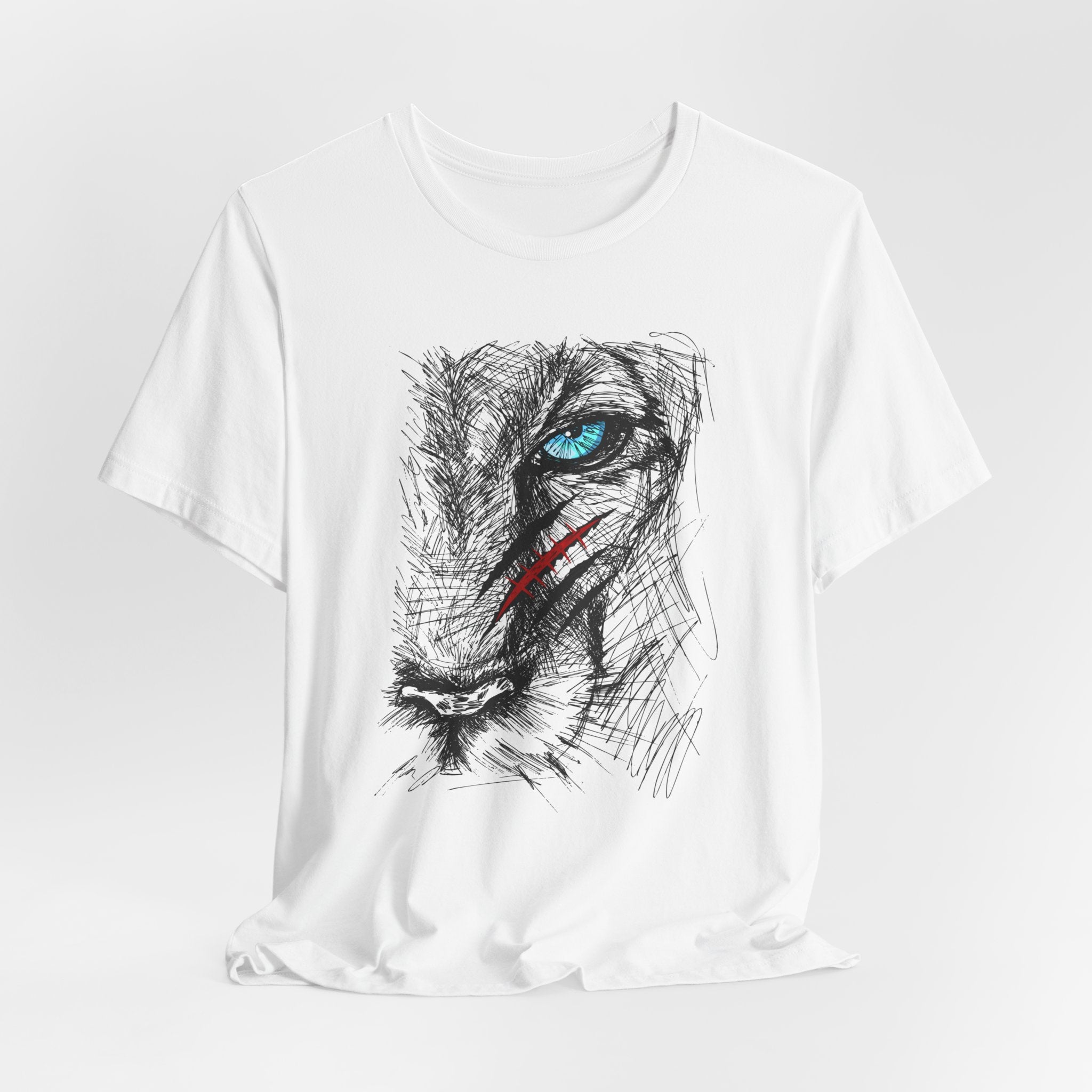 White t-shirt with a graphic of a wounded lion's face with a blue eye