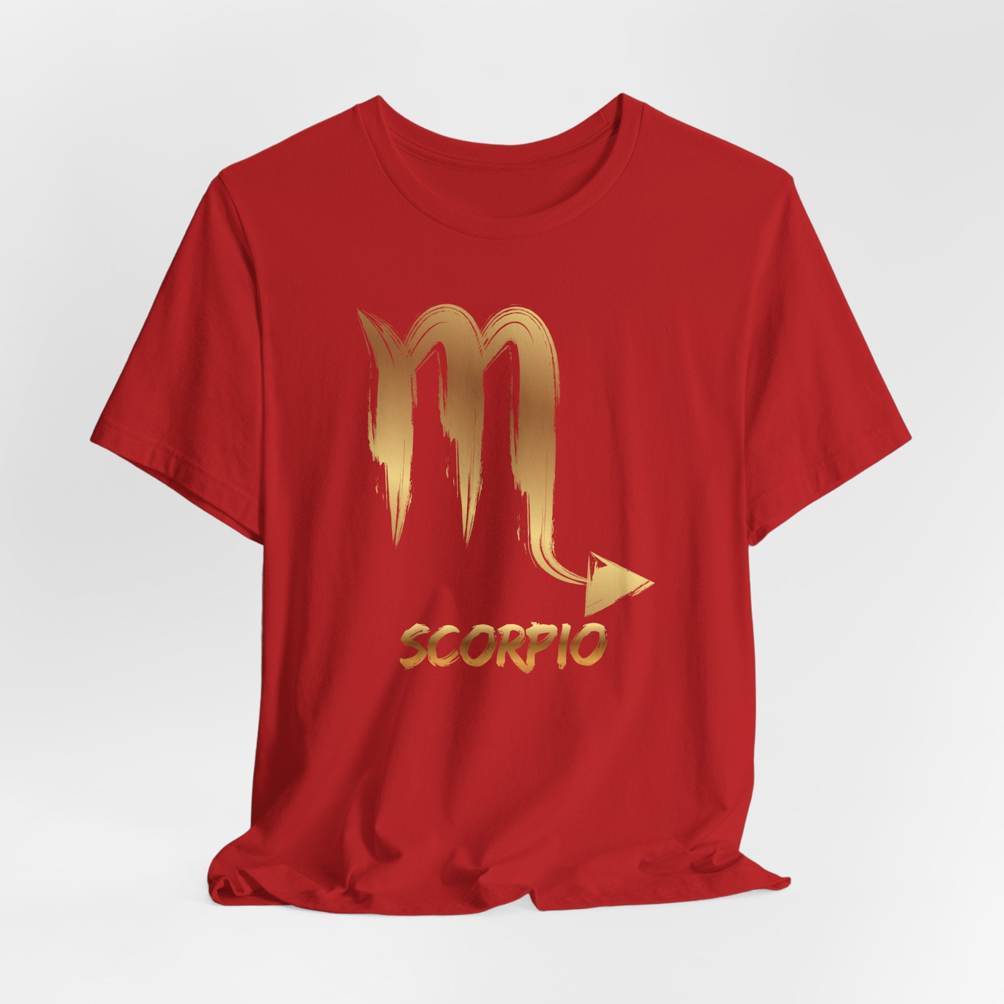 Red t-shirt with gold Scorpio zodiac symbol on a white background