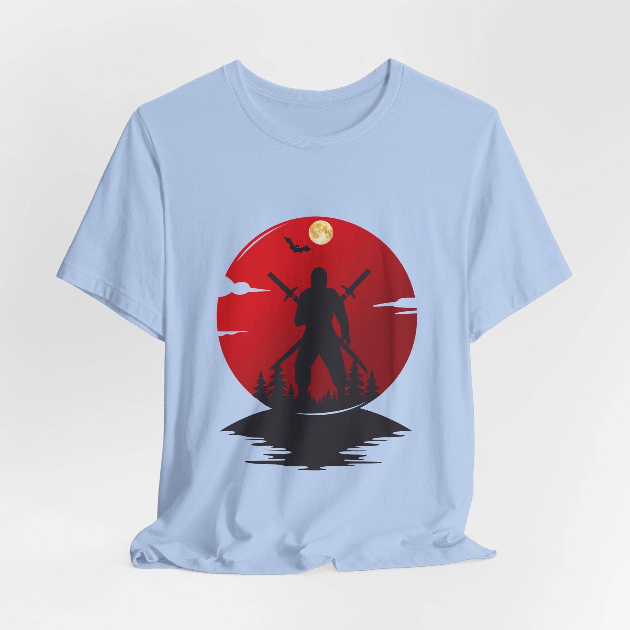 Light blue t-shirt with a red circular design featuring a silhouette of a person holding a spear against a moonlit sky.