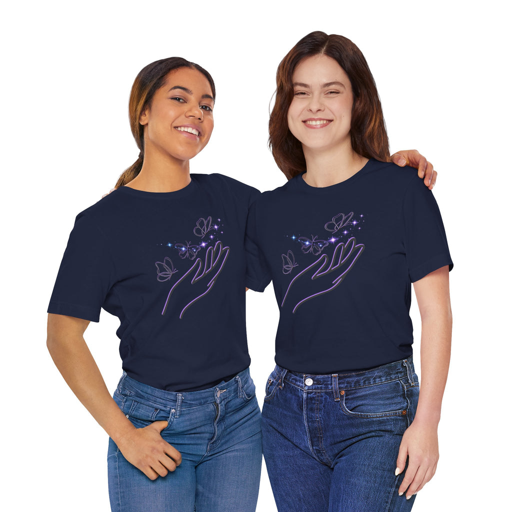 Two women wearing navy blue t-shirts with a design of hands holding butterflies on a white background.