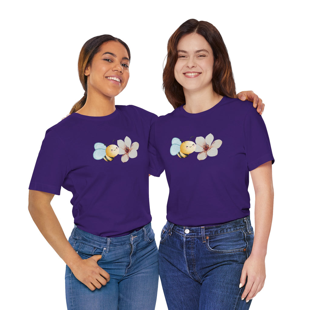 Two people wearing purple t-shirts with a bee and flower design on a white background