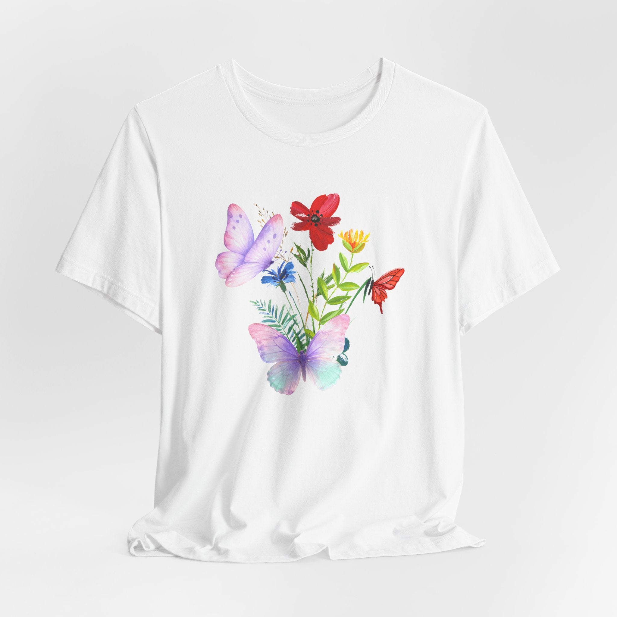 White t-shirt with colorful butterfly and flower design on a white background