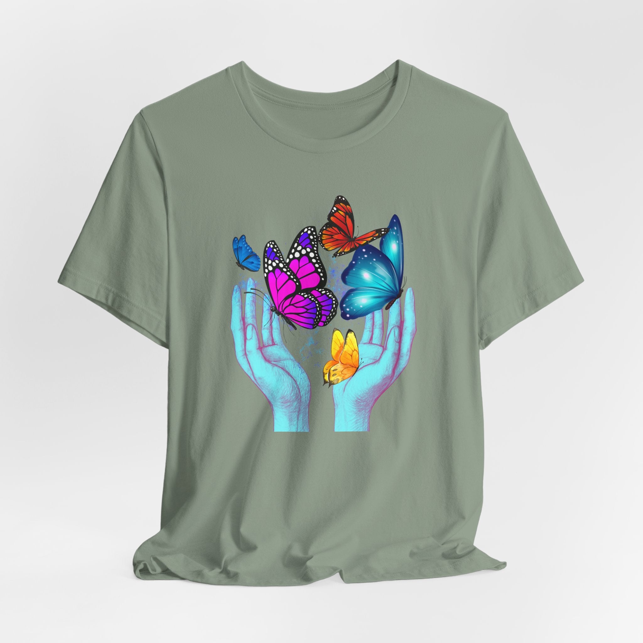 Green t-shirt with colorful butterfly design on a white background