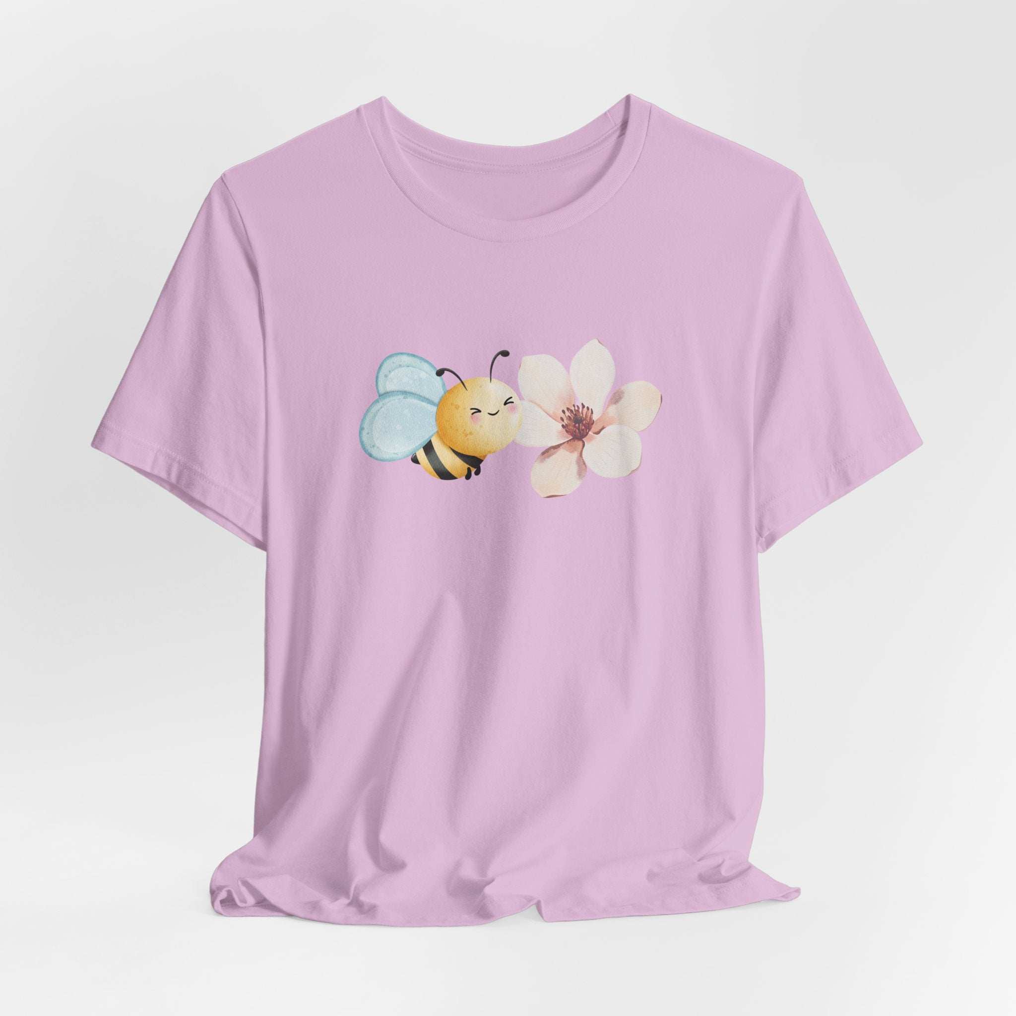 Purple t-shirt with a bee and flower graphic on a light gray background
