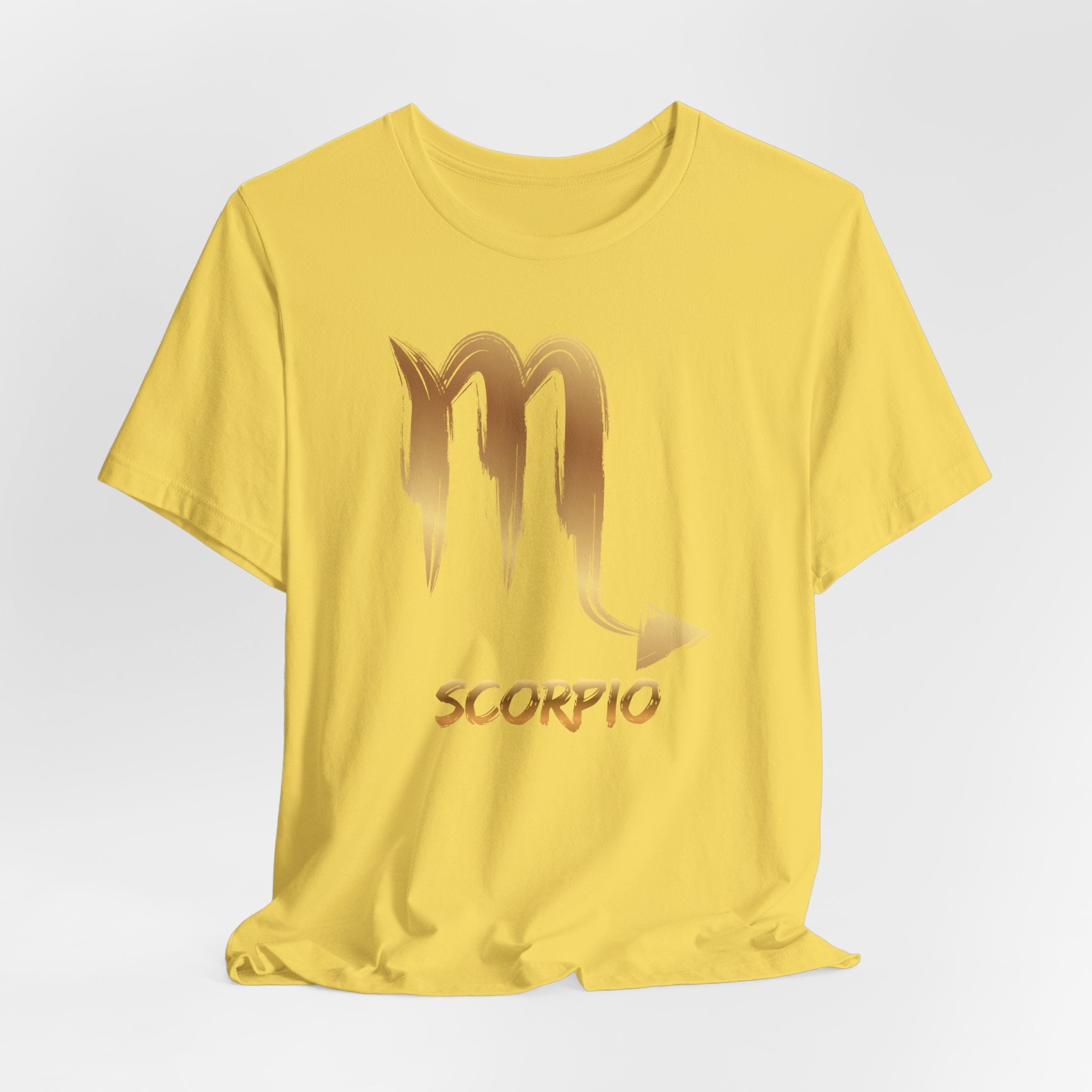 Yellow t-shirt with Scorpio zodiac symbol on a light gray background