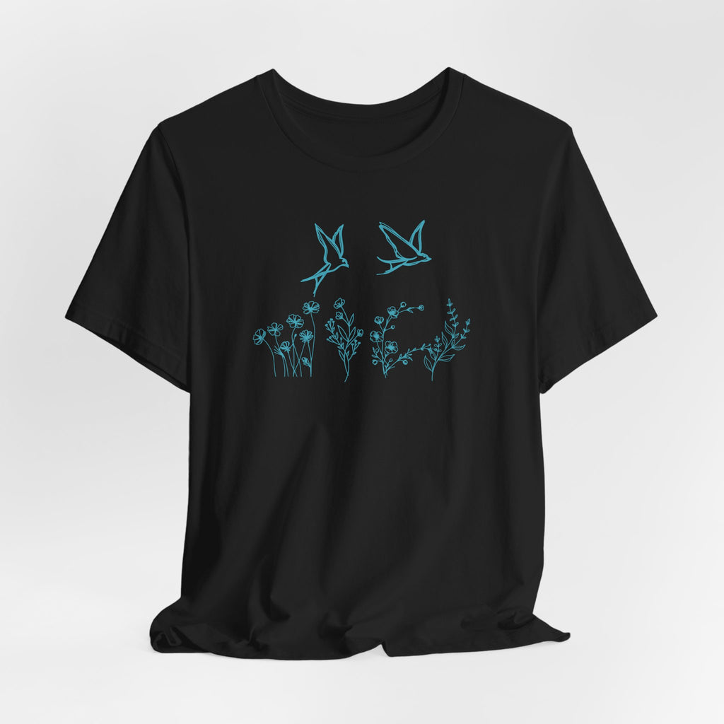 Black t-shirt with blue floral and bird design on a white background