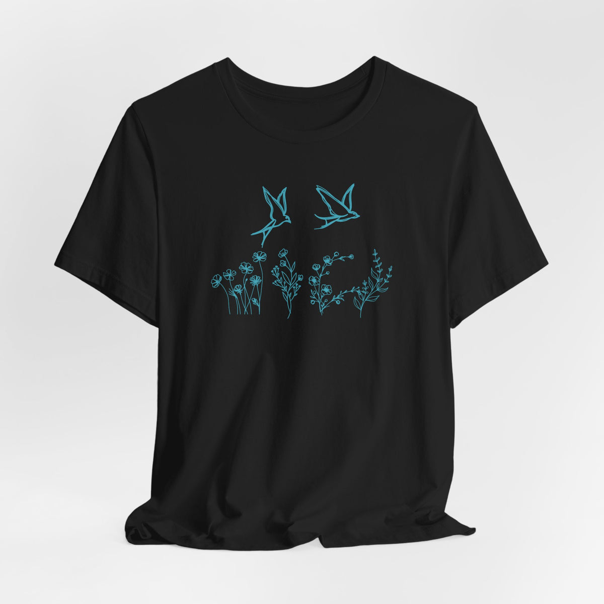 Black t-shirt with blue floral and bird design on a white background