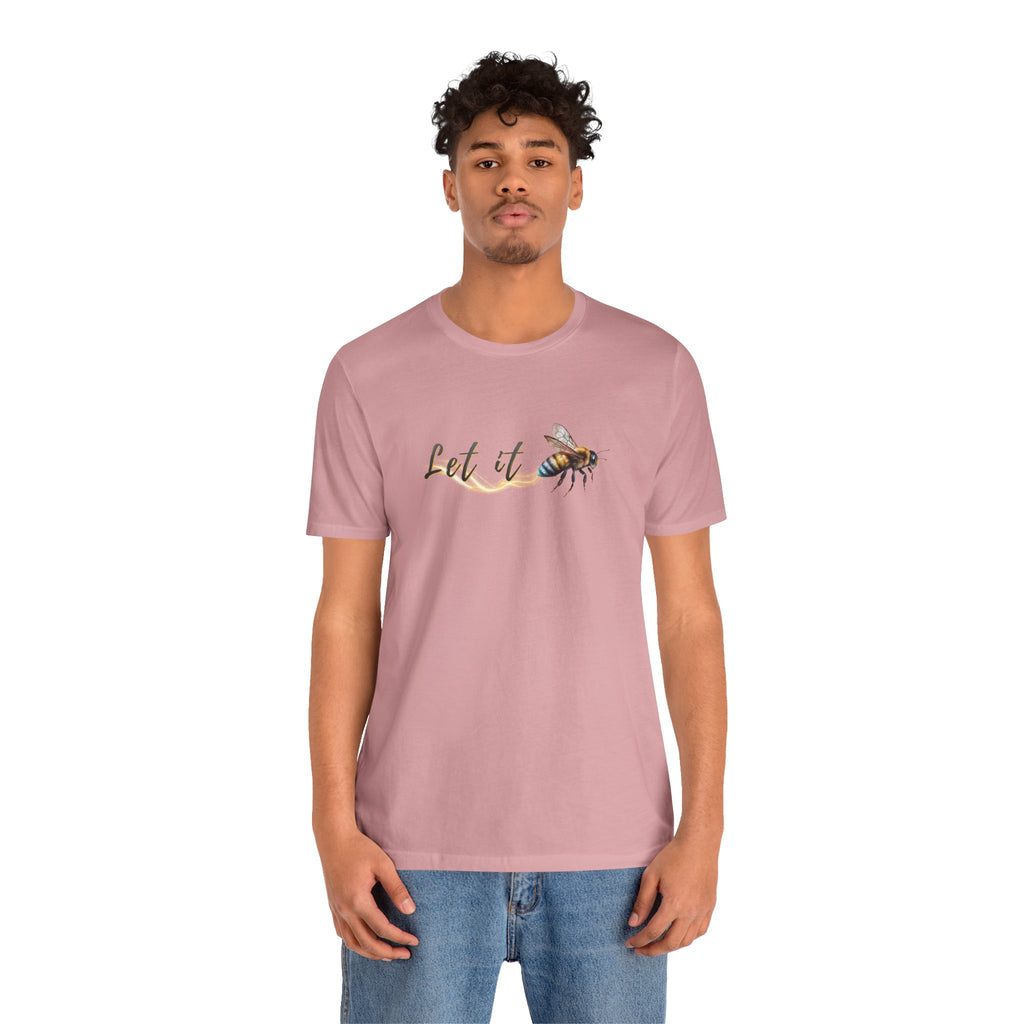 Person wearing a pink t-shirt with a graphic design on a white background