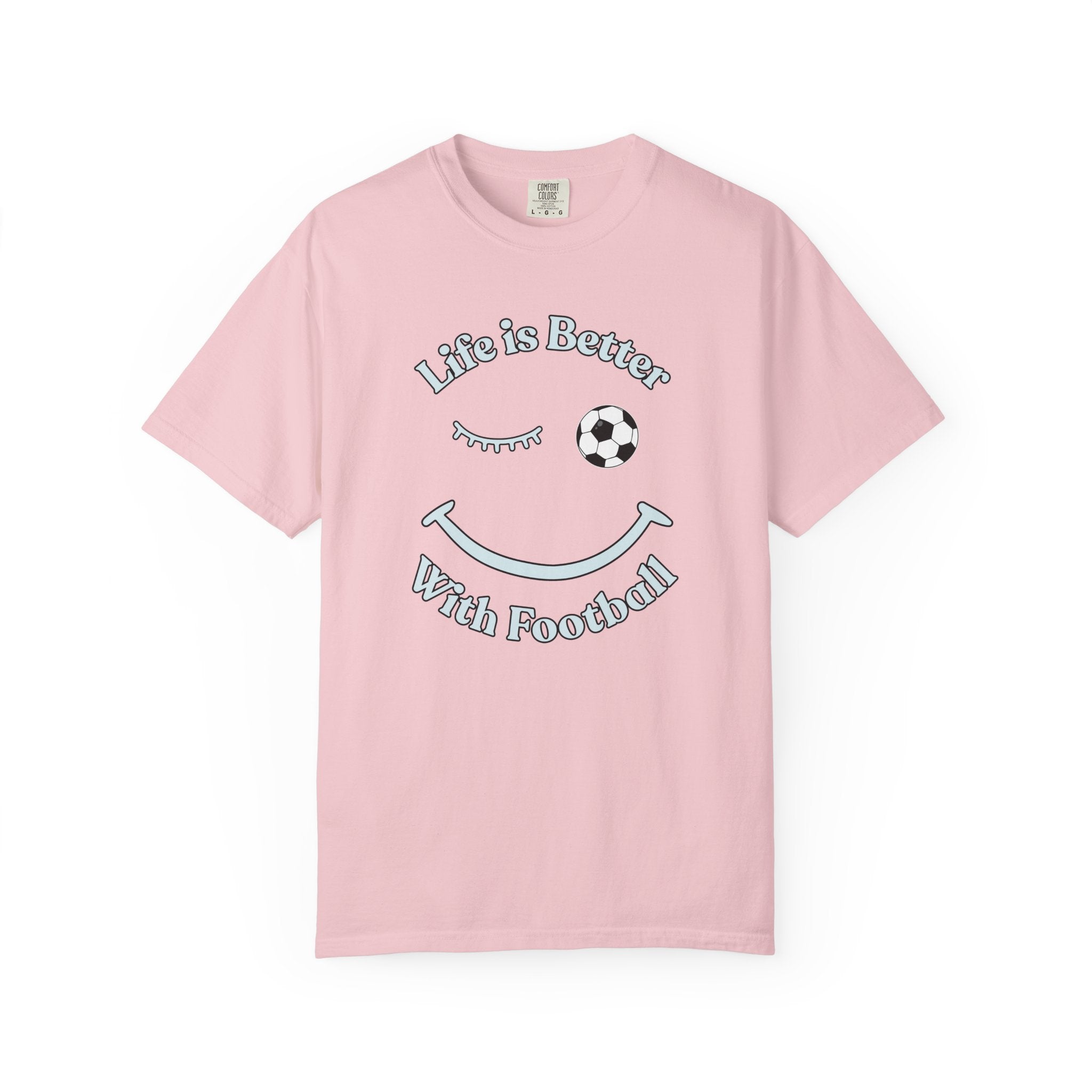 Pink t-shirt with 'Life is Better With Football' text and smiley face design on a white background