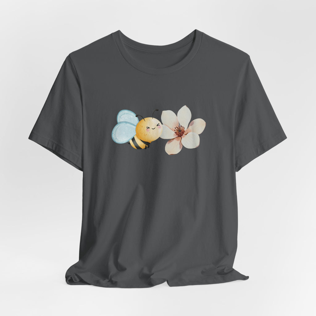 Gray t-shirt with a bee and flower graphic on a light gray background