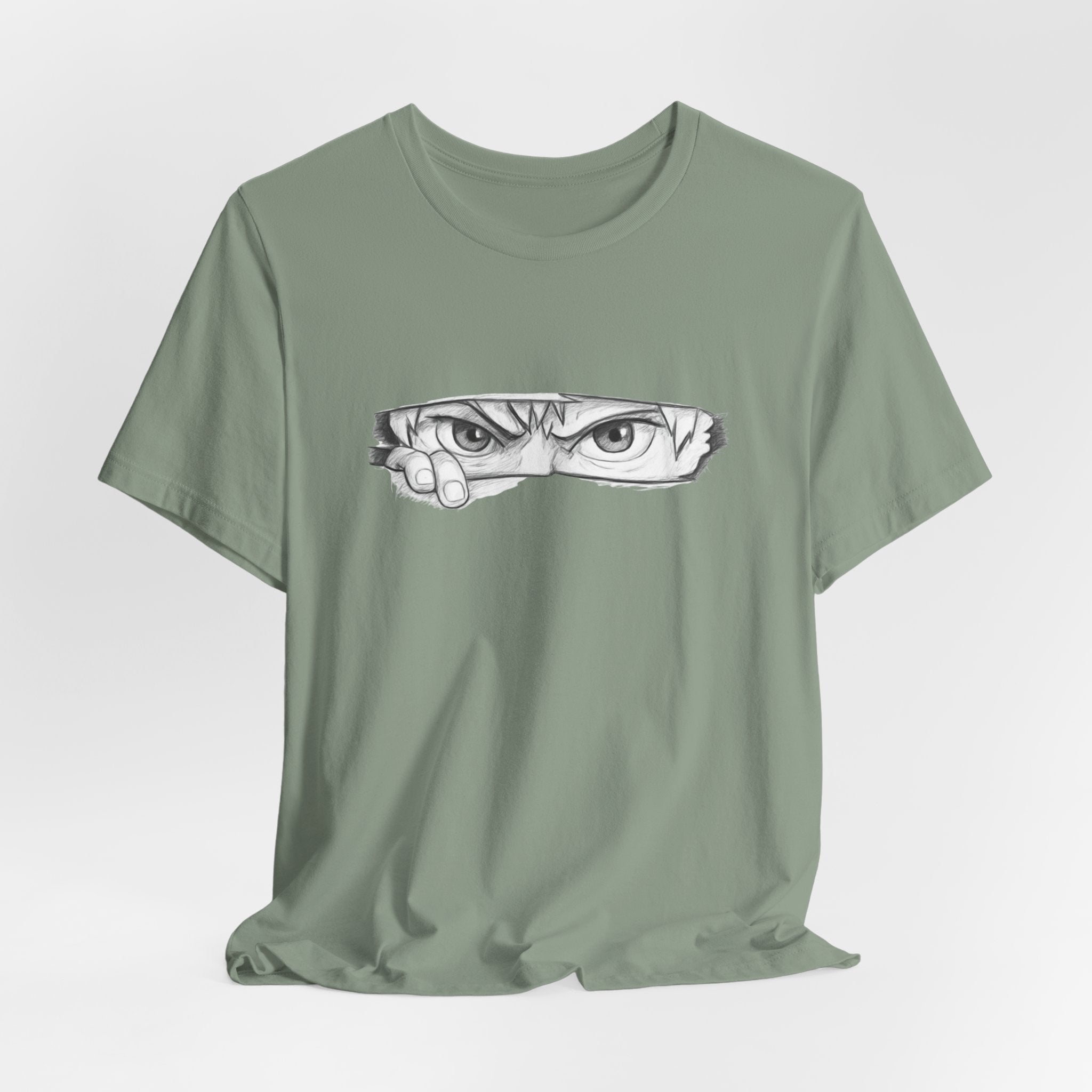 Green t-shirt with a graphic of a face on a white background
