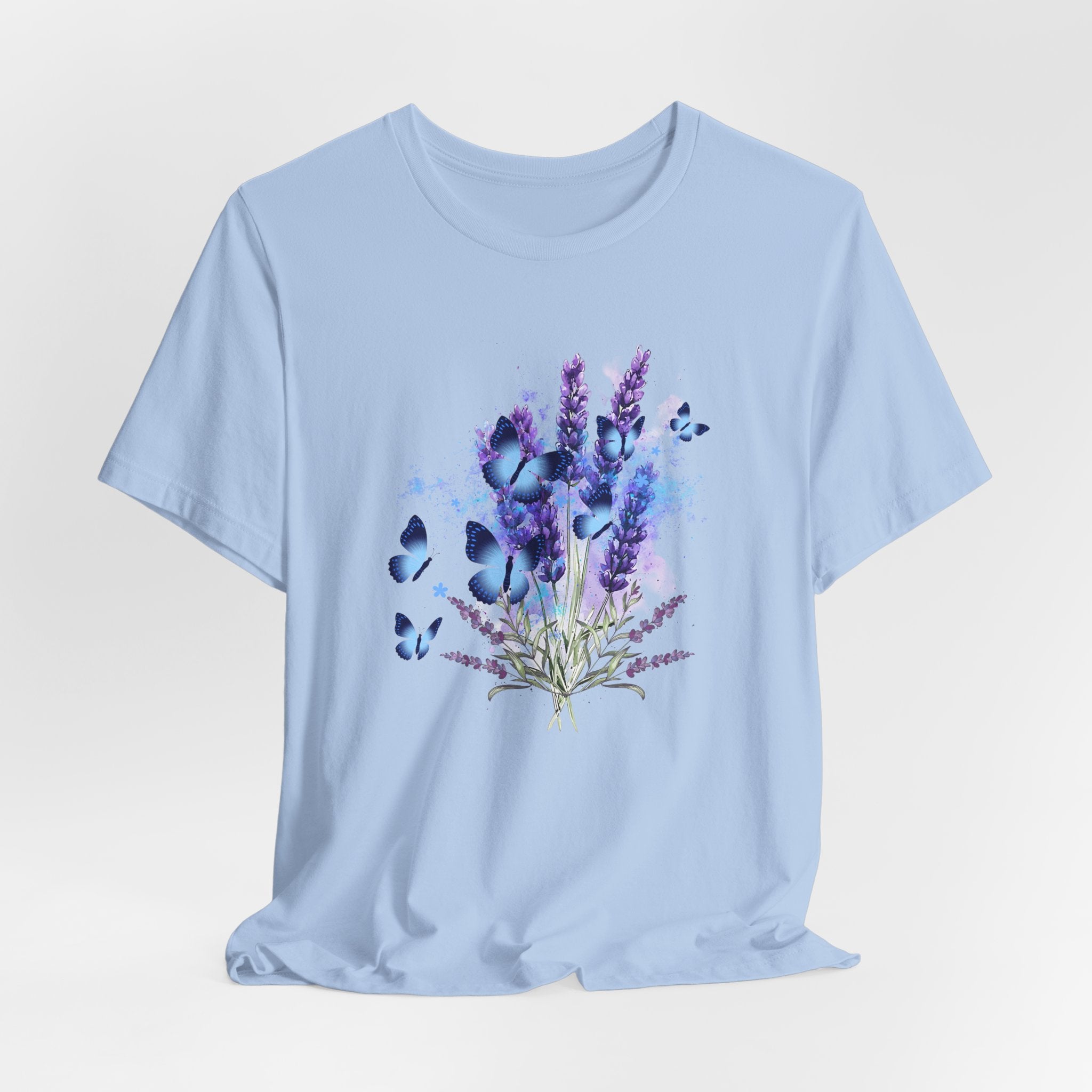 Light blue t-shirt with a floral and butterfly design on a light gray background