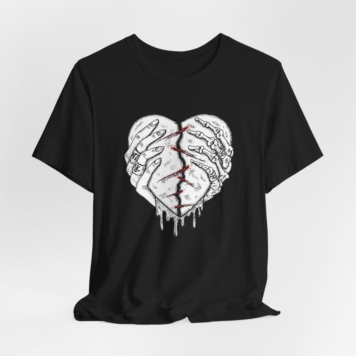 Black t-shirt with a graphic design of two hands holding a heart on a white background