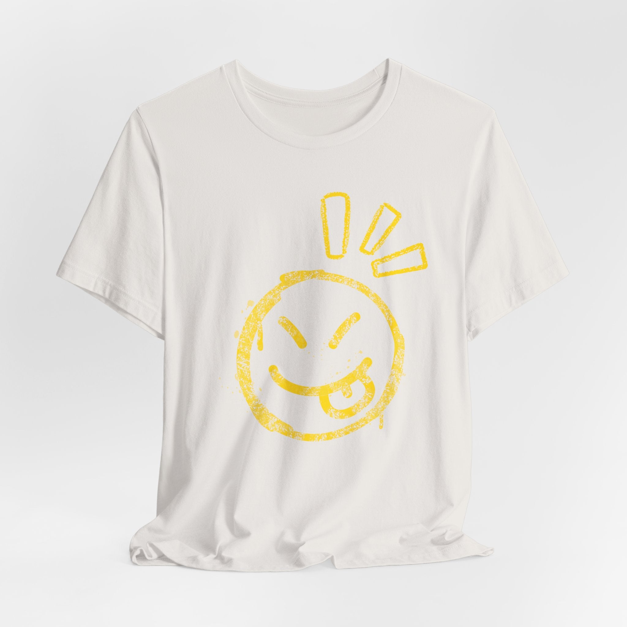 White t-shirt with a yellow smiley face design on a light gray background