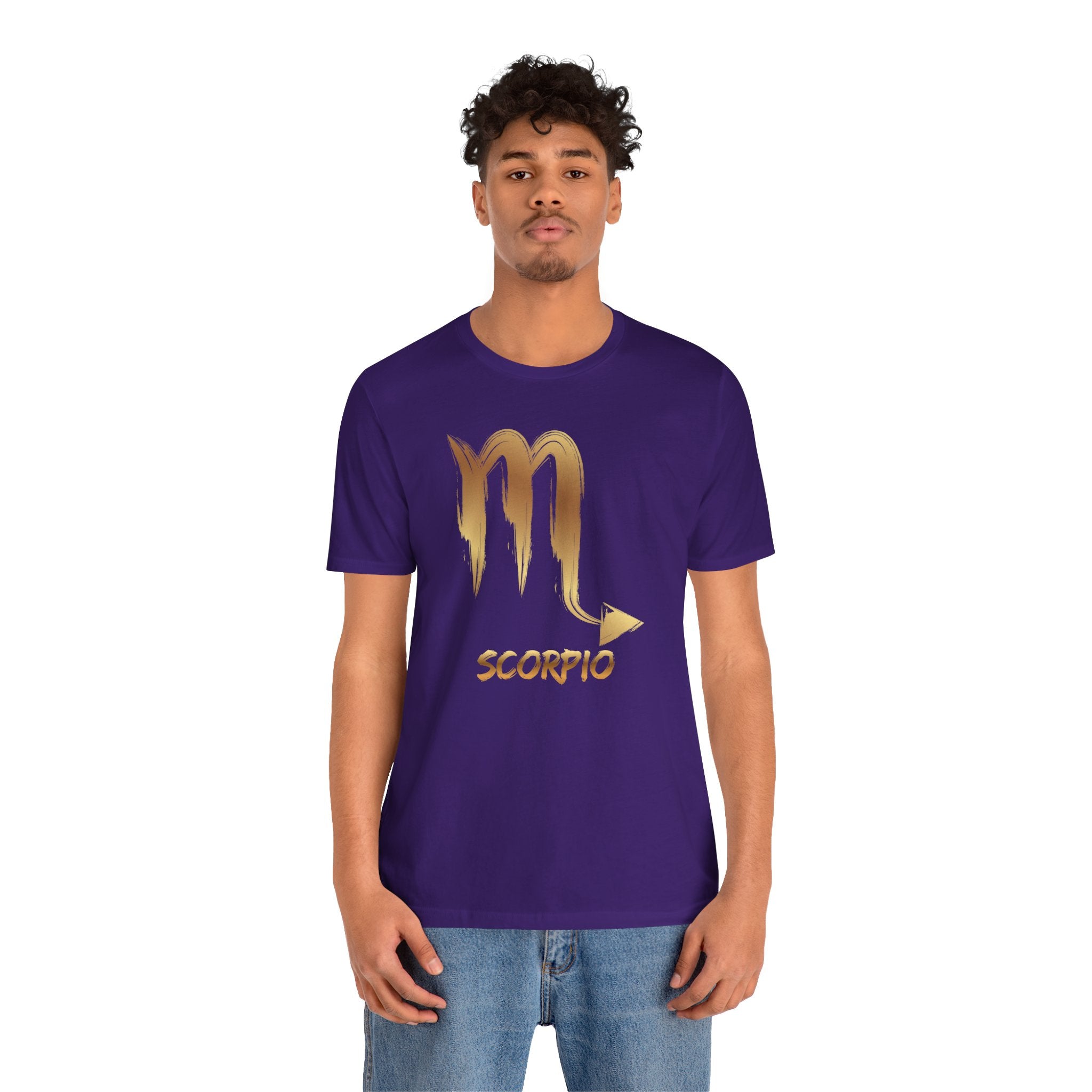 Person wearing a purple t-shirt with Scorpio symbol and text on a white background