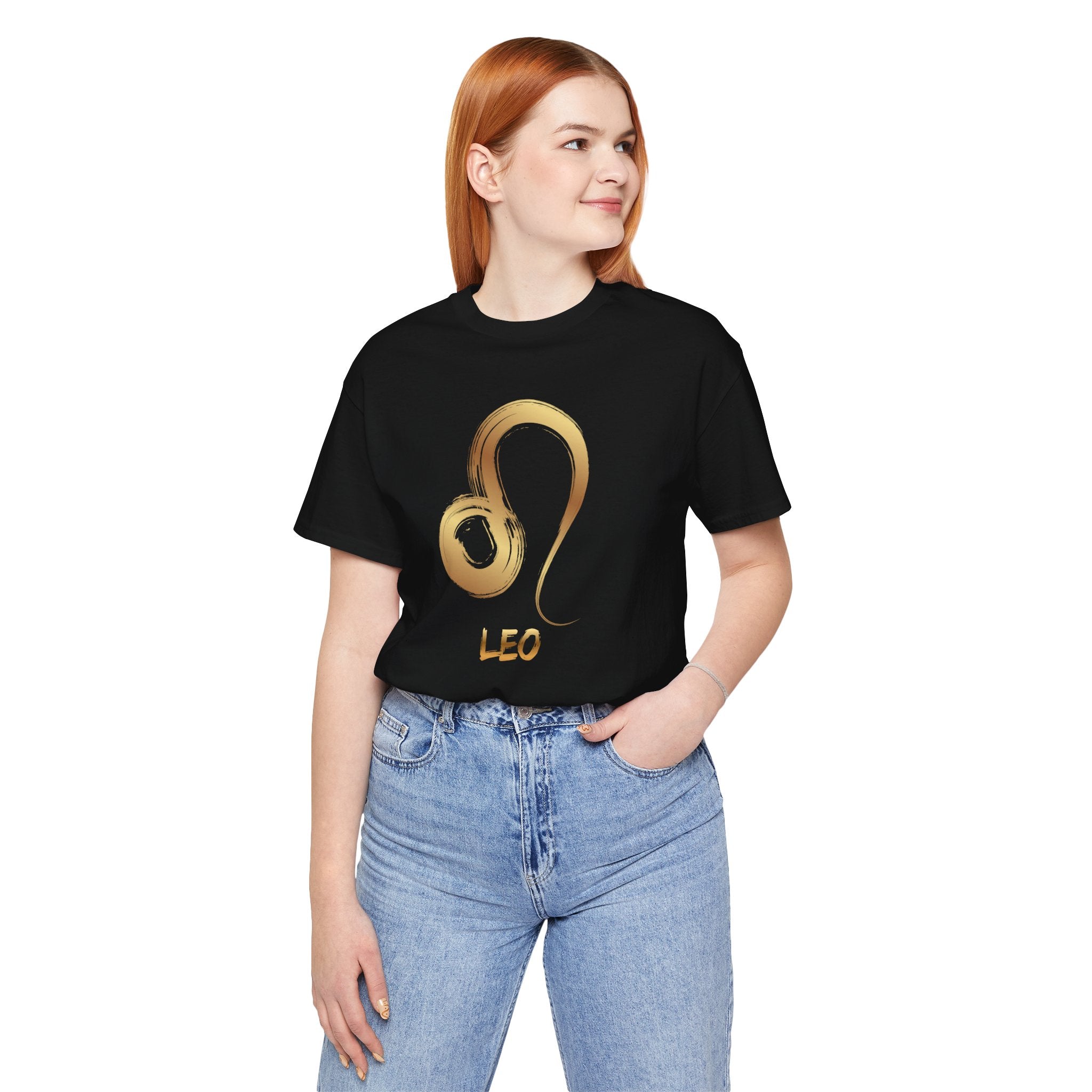 Person wearing a black t-shirt with a gold Leo zodiac symbol design on a white background