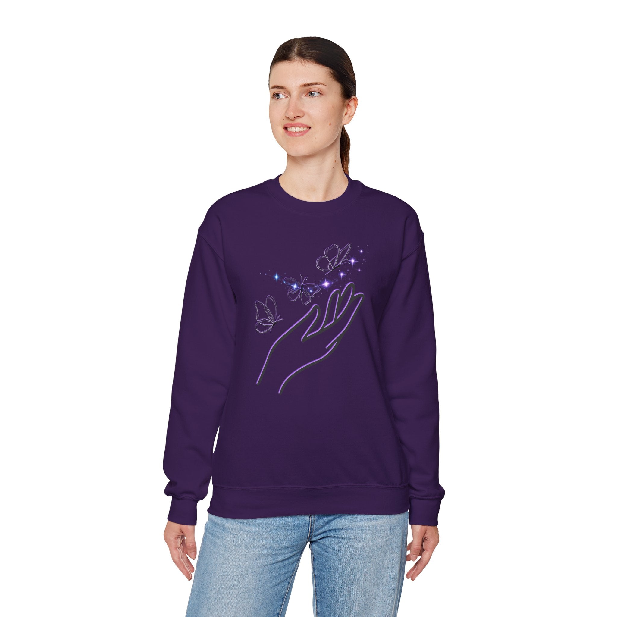 Person wearing a purple sweatshirt with a hand and butterfly design on a white background