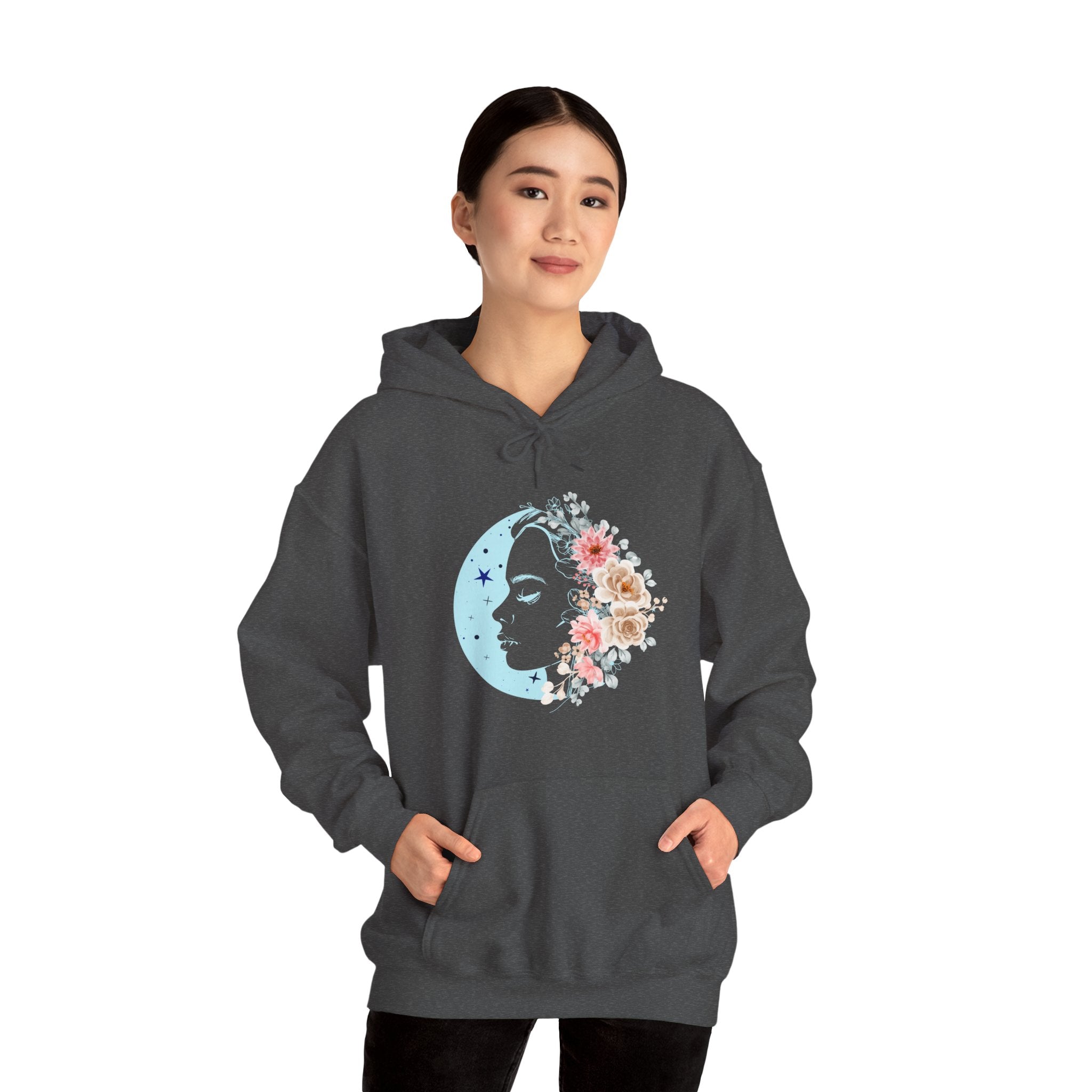 Person wearing a dark gray hoodie with floral face moon design on a white background