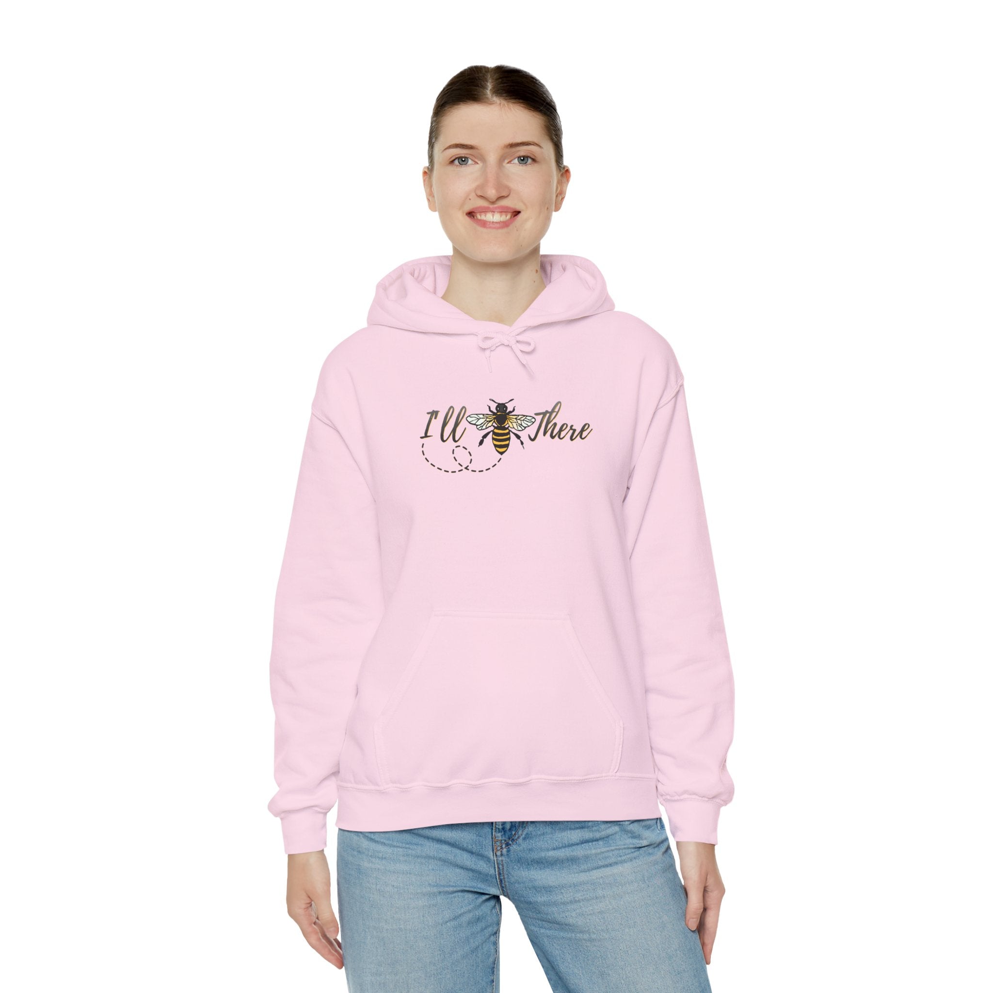 Person wearing a pink hoodie with text and a bee graphic on a white background