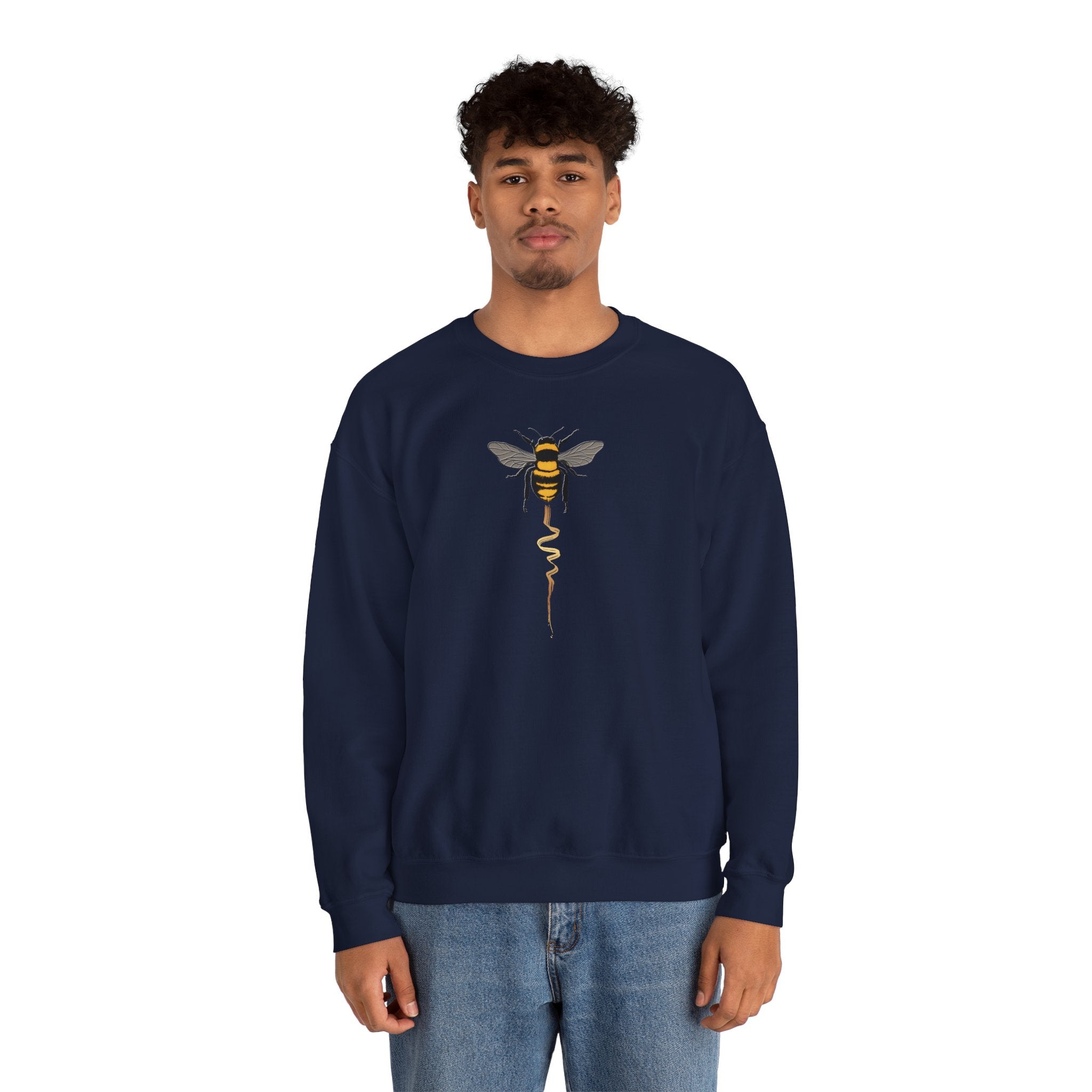 Man wearing a navy blue sweatshirt with a bee graphic on a white background