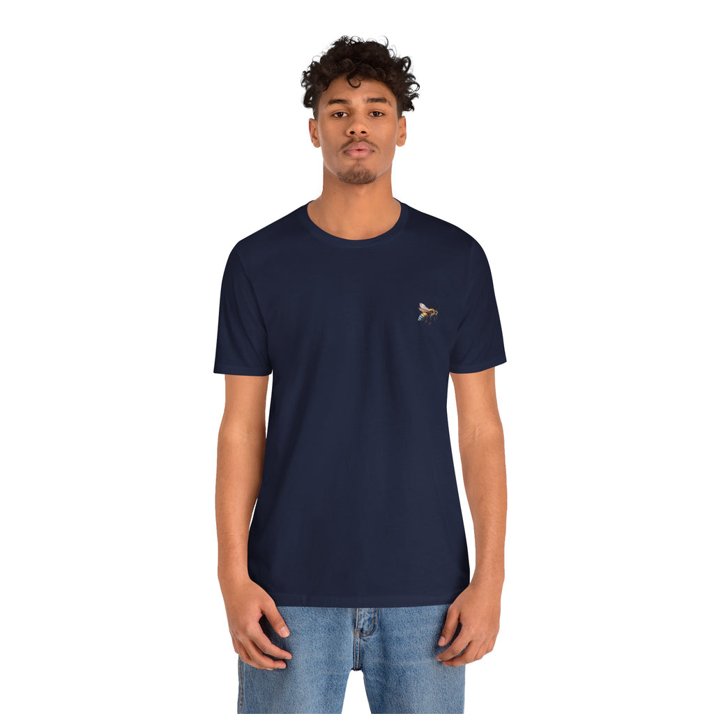 Man wearing a navy blue t-shirt with a small logo on a white background