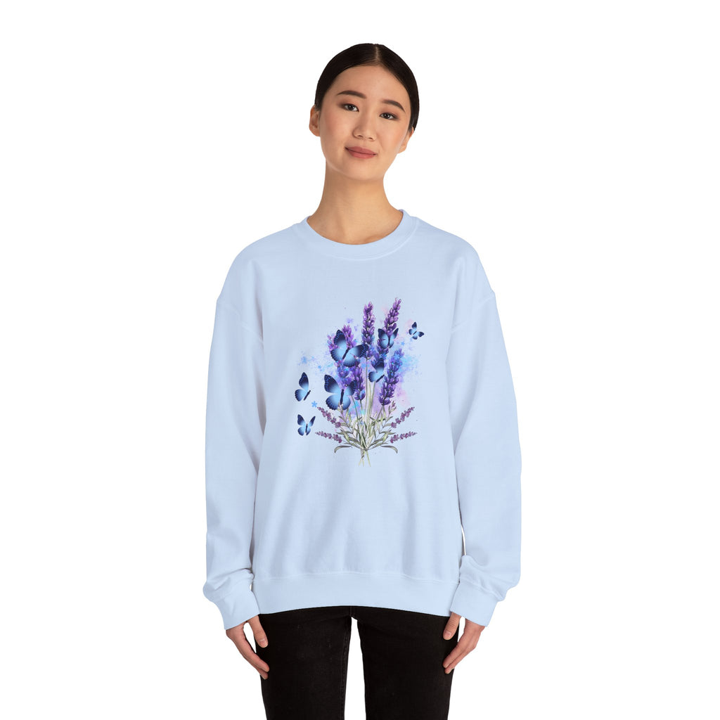 Light blue sweatshirt with floral design worn by a person on a white background