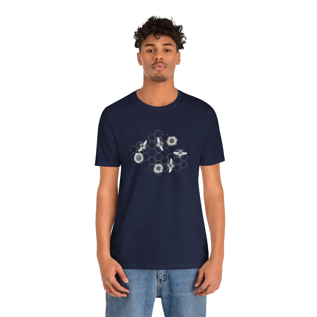 Person wearing a navy blue t-shirt with a geometric design on a white background
