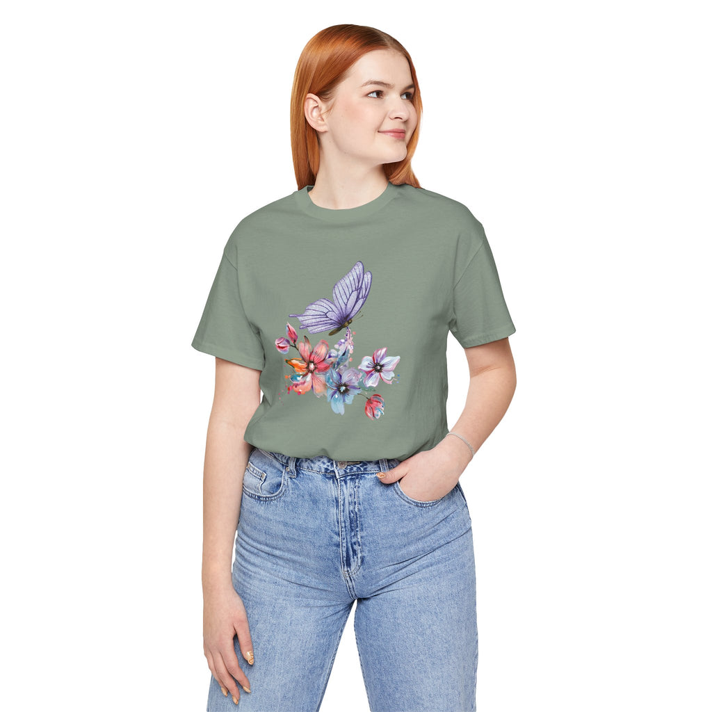 Person wearing a green t-shirt with a floral and butterfly design on a white background