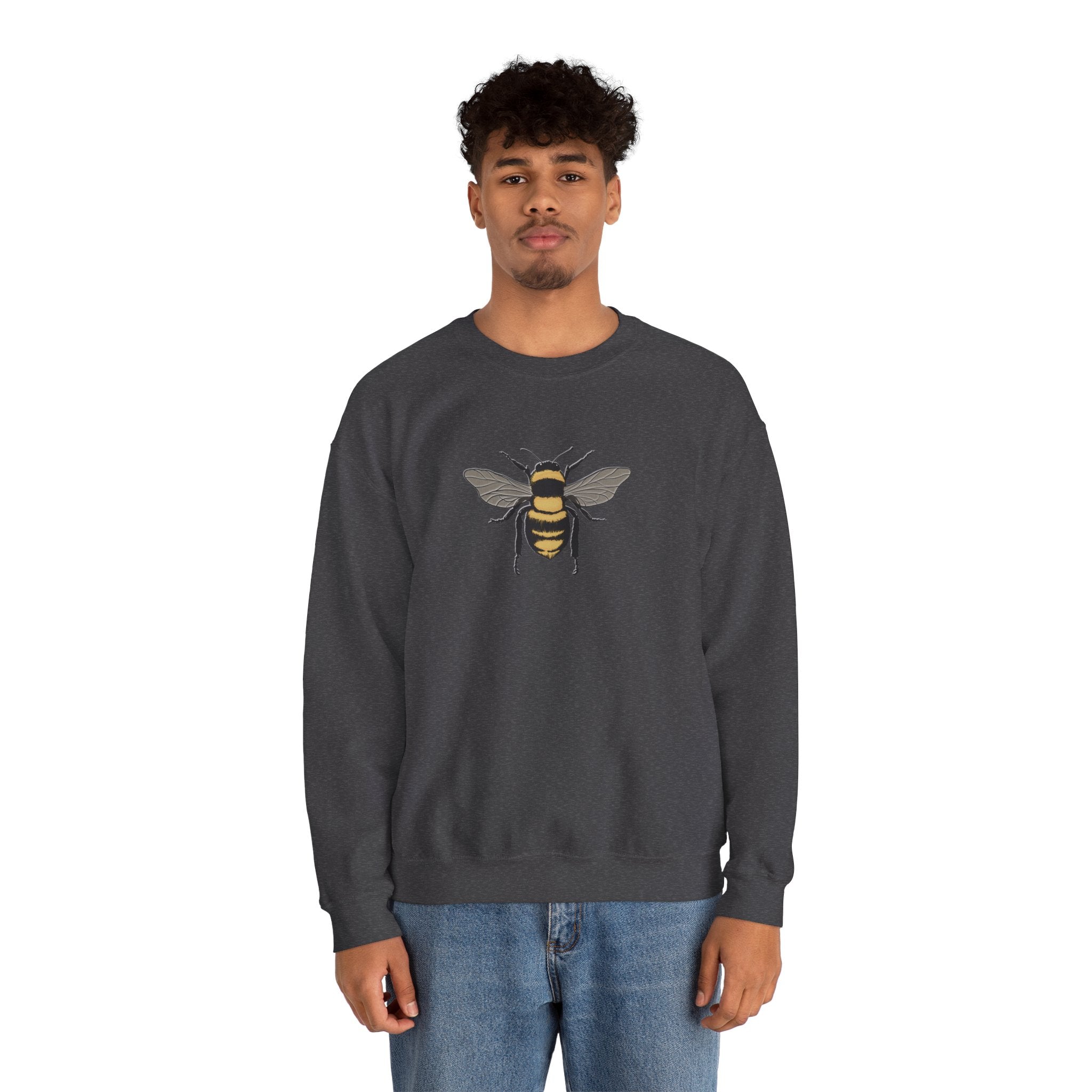 Person wearing a dark gray sweatshirt with bee graphic on a white background