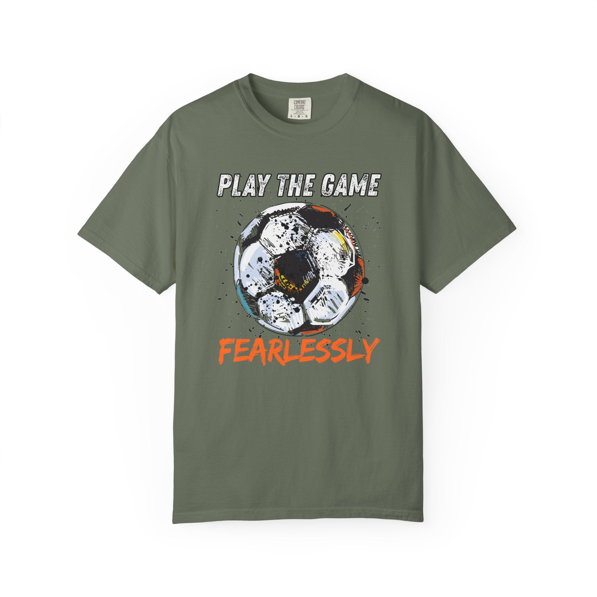 Green t-shirt with dirty soccer ball graphic and play the game fearlessly text on a white background