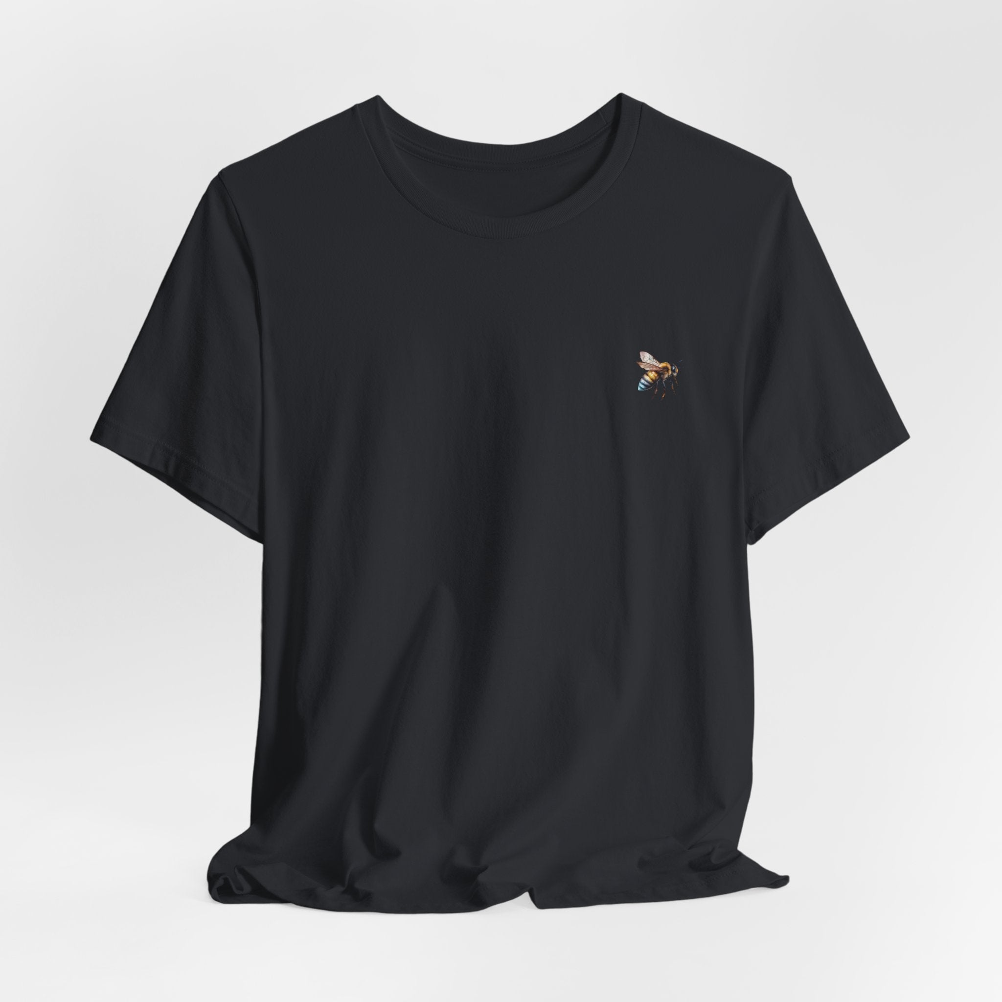 Black t-shirt with a bee design on a light gray background