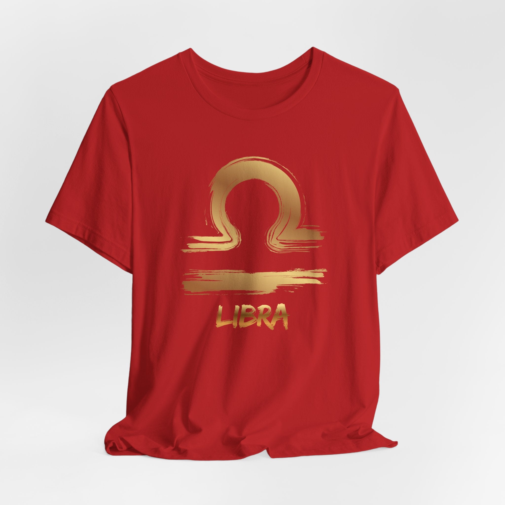 Red t-shirt with gold Libra zodiac symbol on a white background