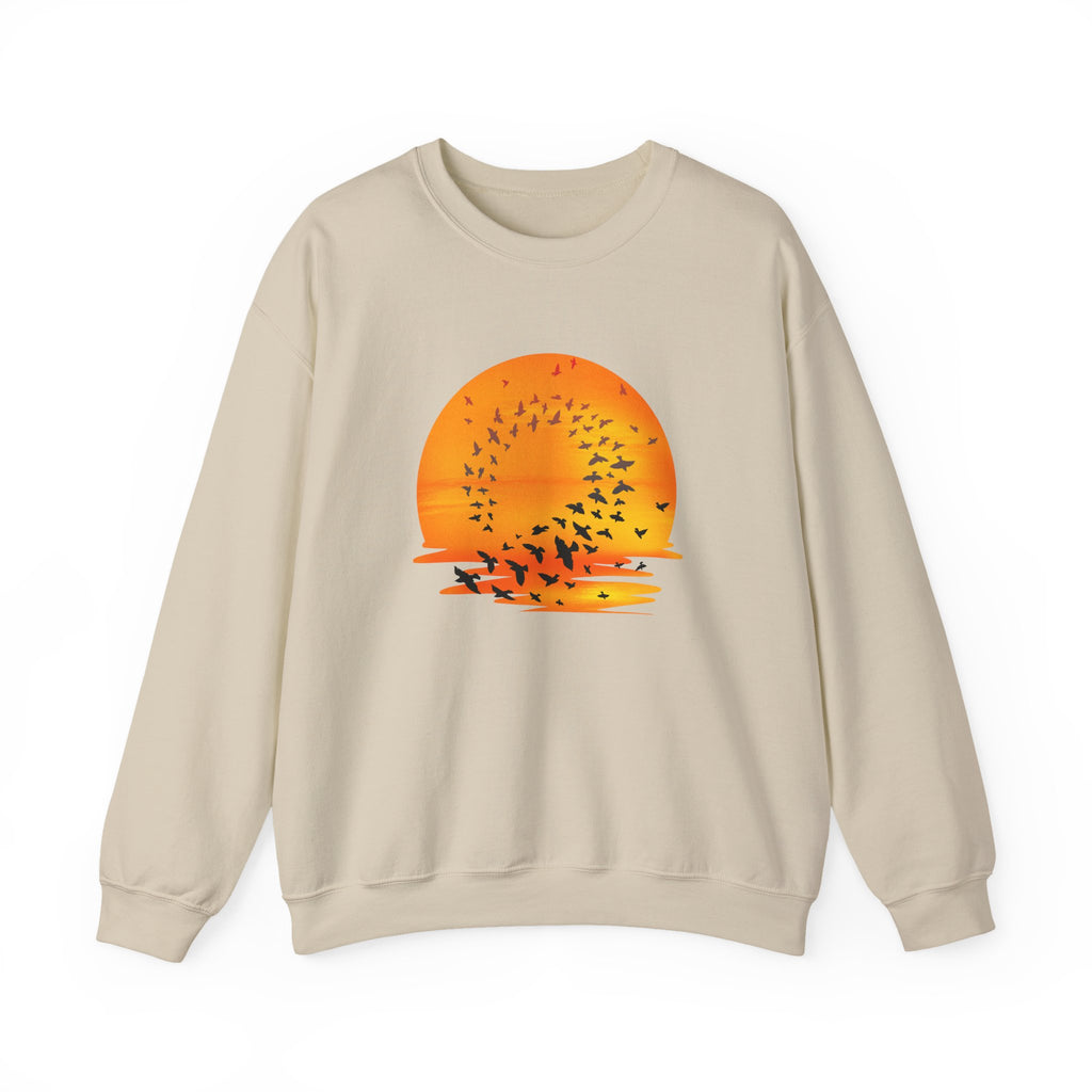 Beige sweatshirt with a sunset and bird design on a white background