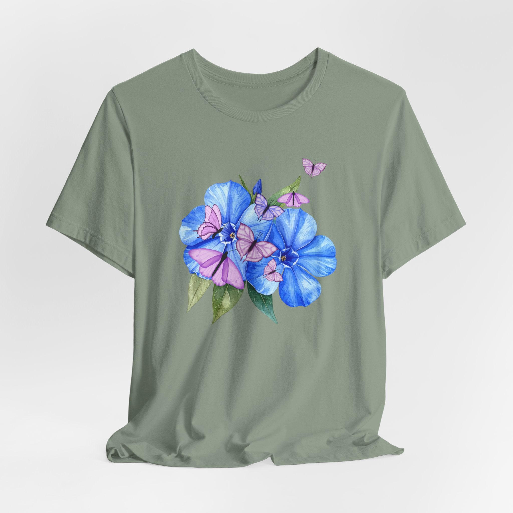 Green t-shirt with blue floral design on a light gray background