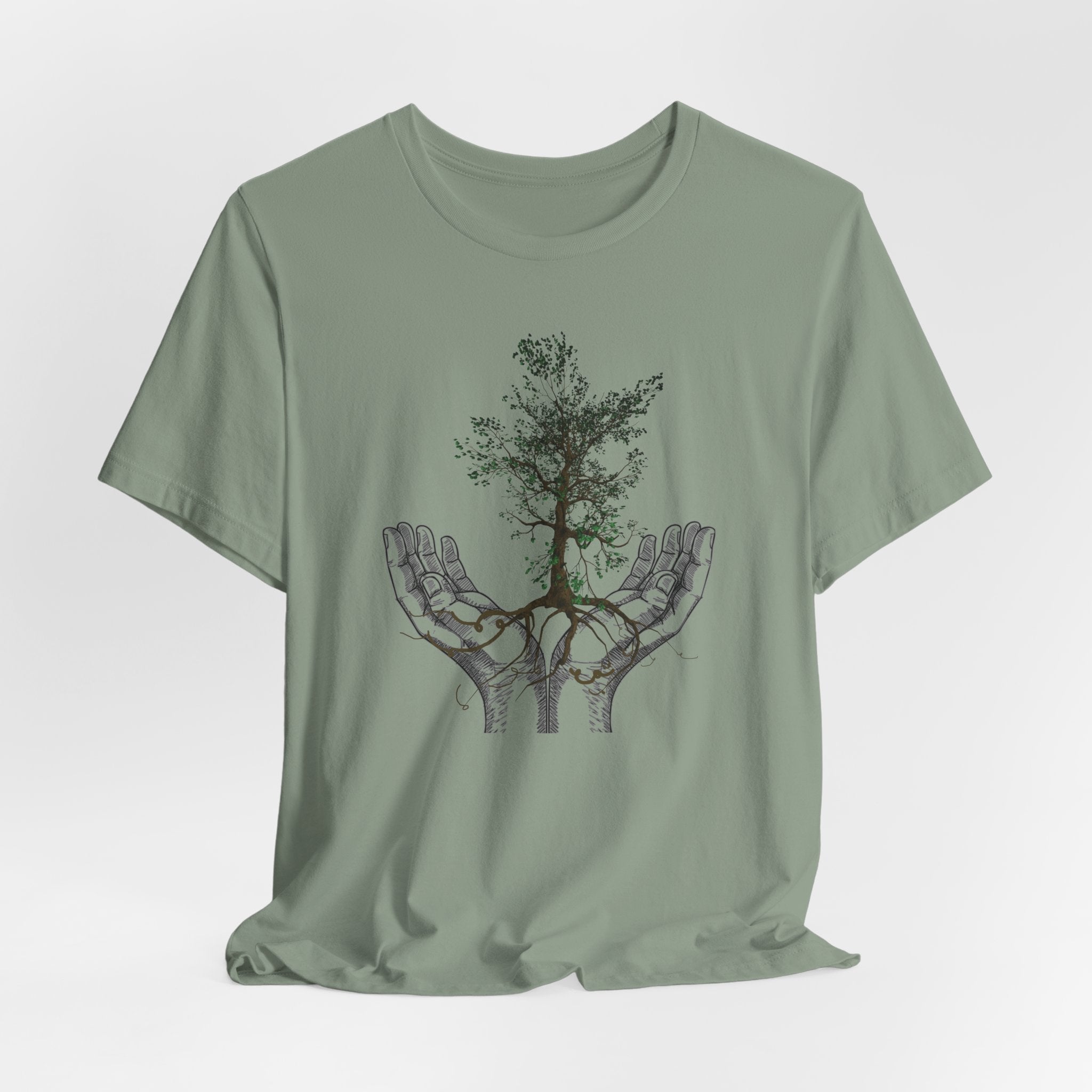 Sage green t-shirt with a tree design on a white background