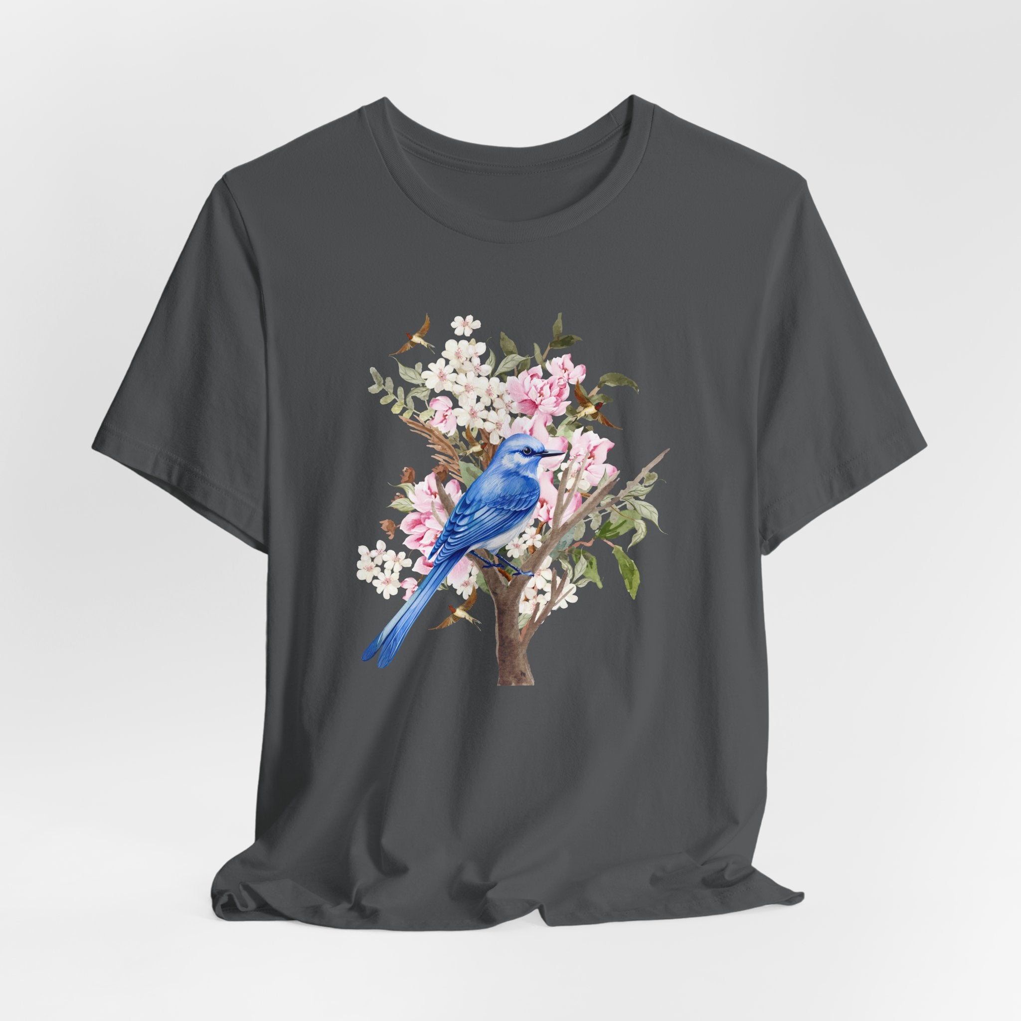Black t-shirt with a blue bird and floral design on a white background