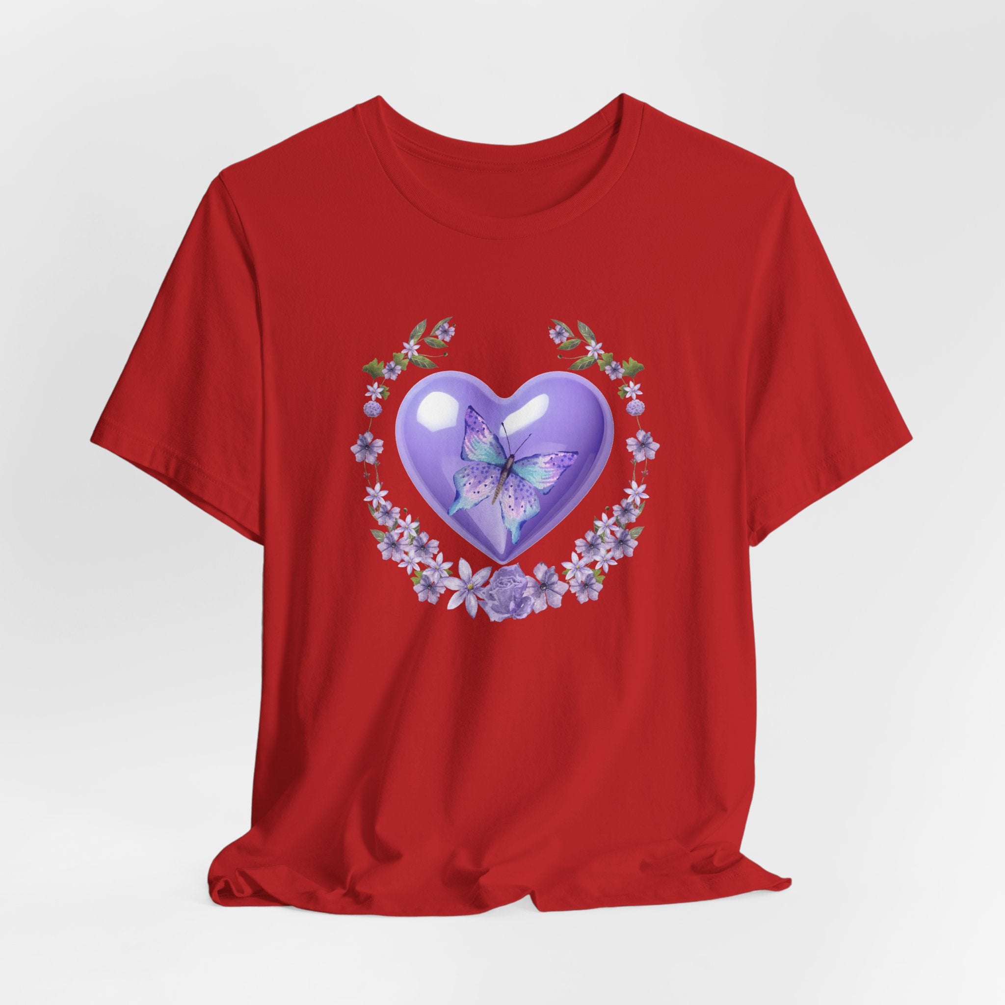 Red t-shirt with a heart design featuring a butterfly and flowers on a white background