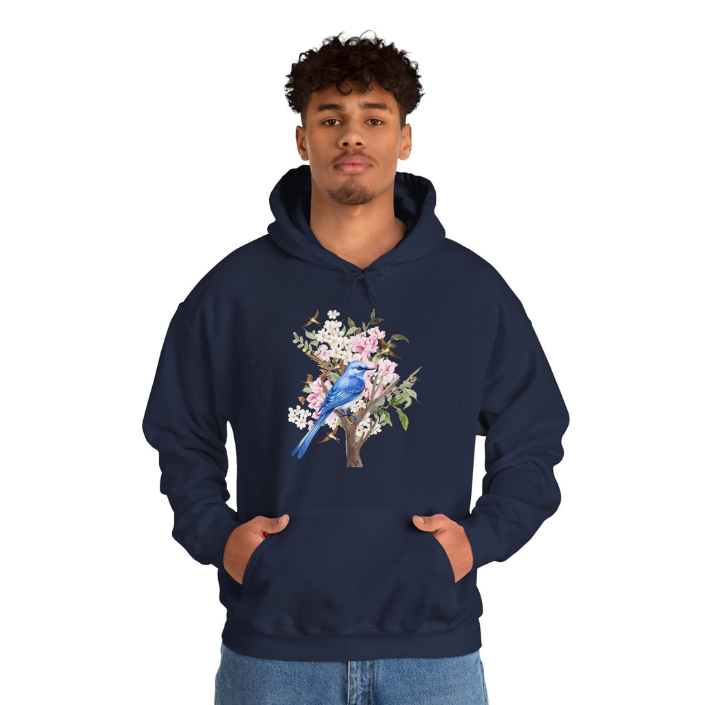Person wearing a navy hoodie with a floral and bird design on a white background