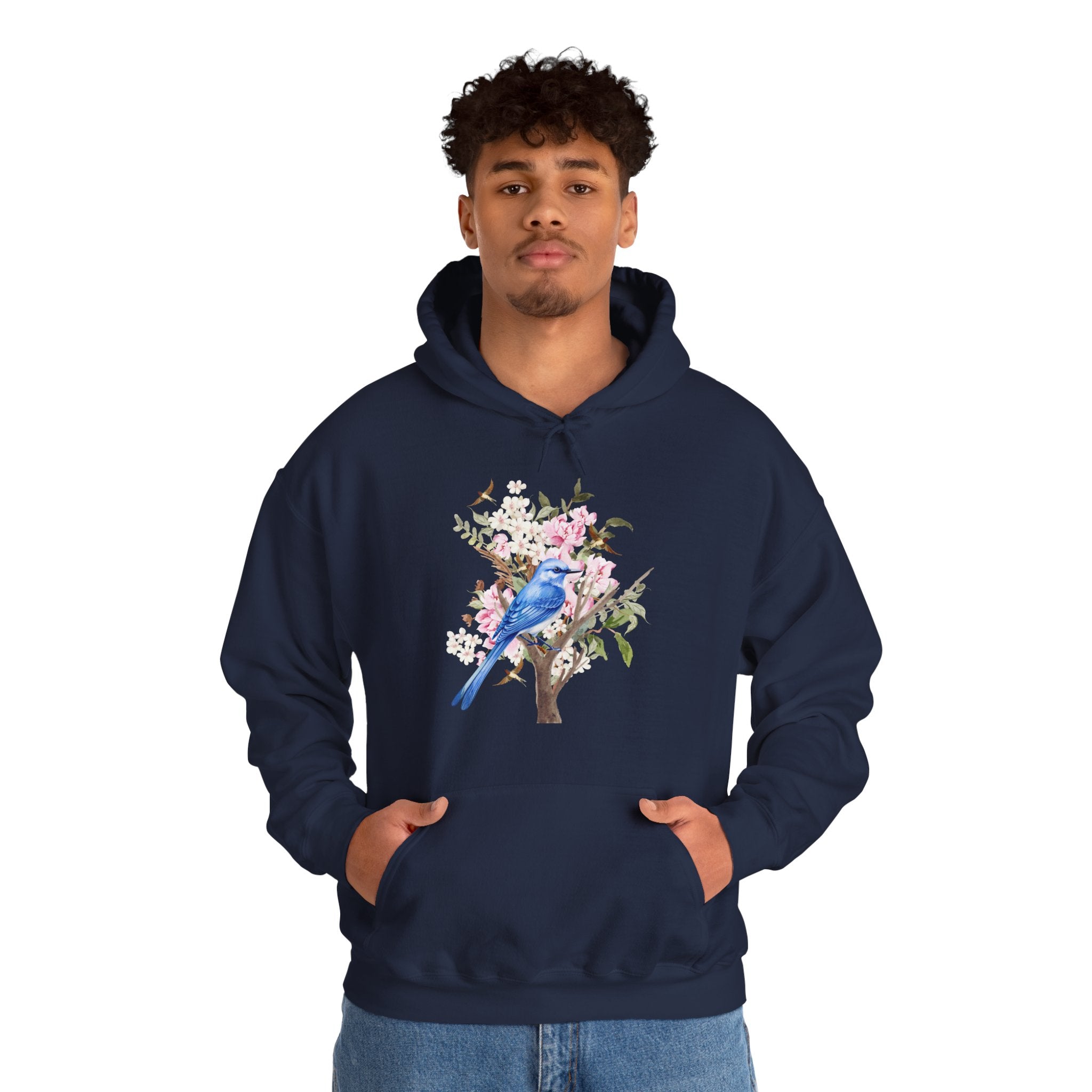 Person wearing a navy hoodie with a floral and bird design on a white background
