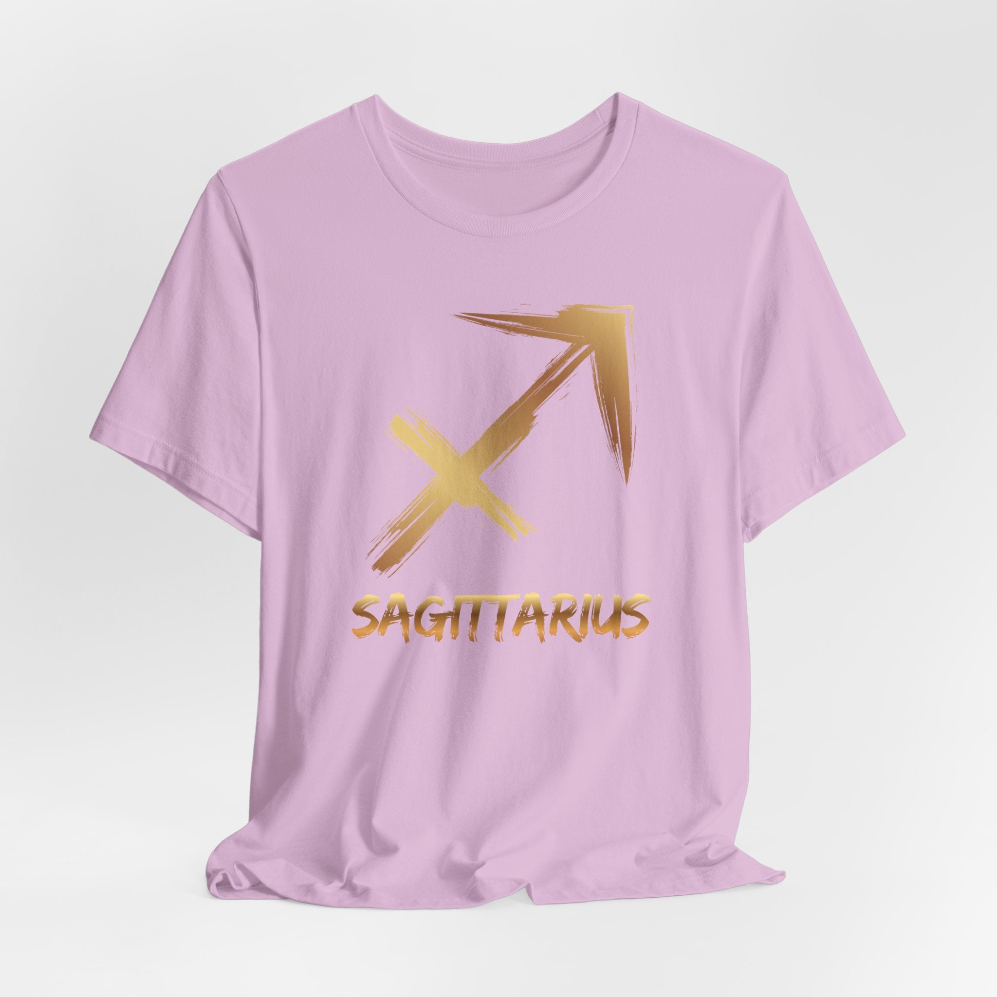Lavender t-shirt with gold Sagittarius symbol and text on a light gray background