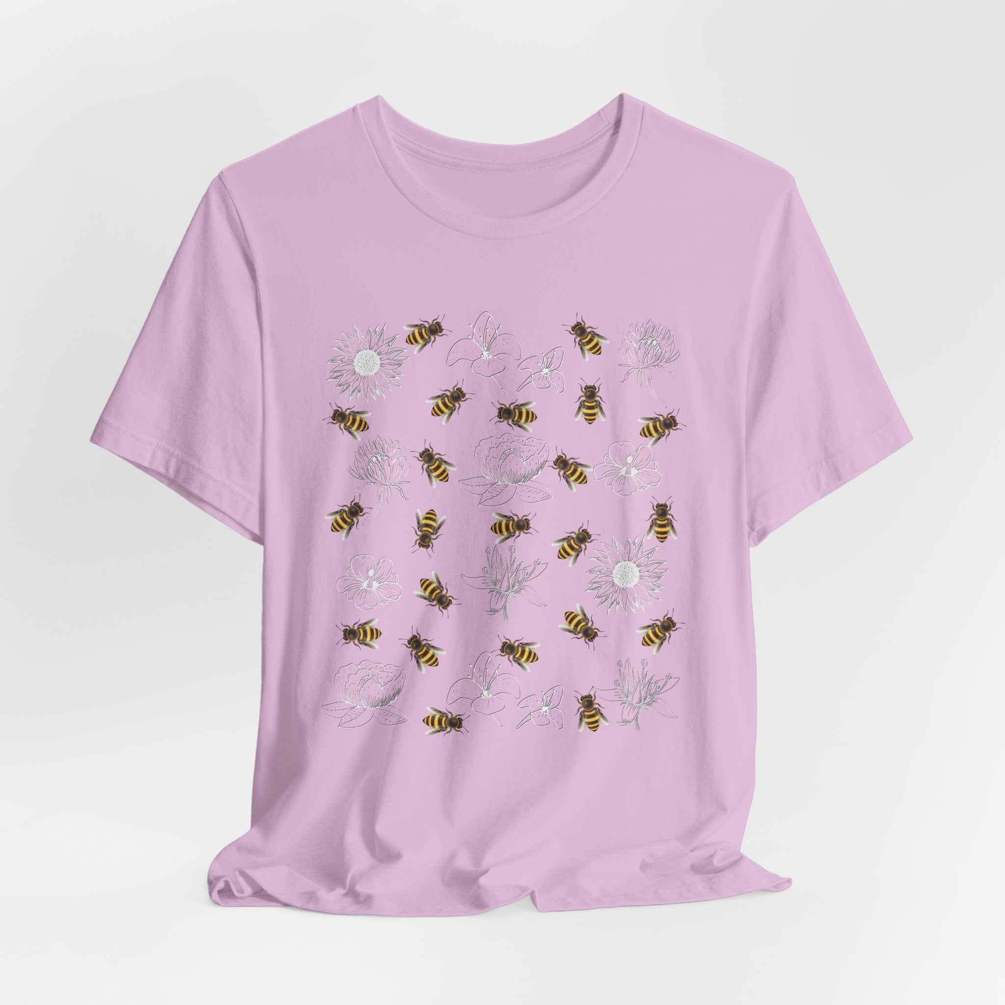 Light purple t-shirt with bee and flower pattern on a light gray background