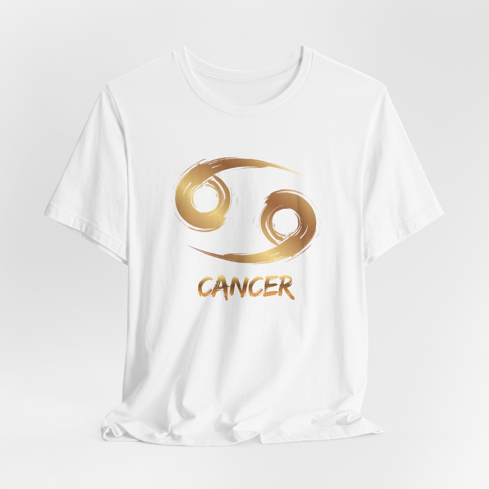 White t-shirt with gold Cancer zodiac symbol on a white background