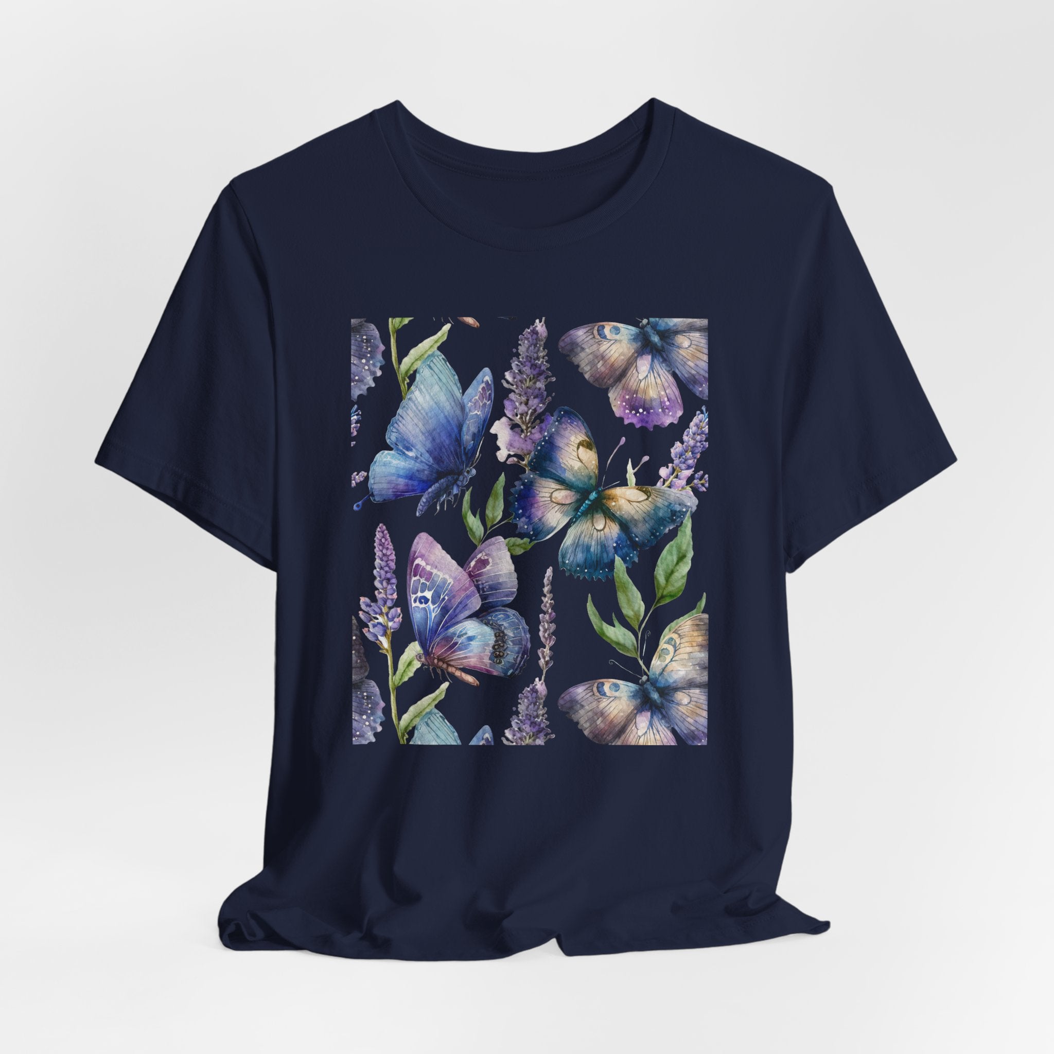Navy blue t-shirt with butterfly and floral design on a light gray background