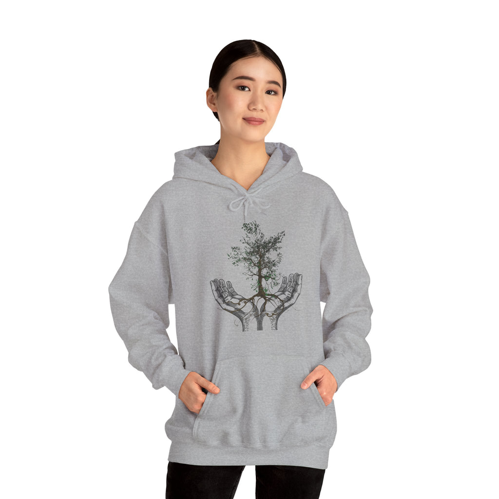Person wearing a gray hoodie with a tree design on a white background