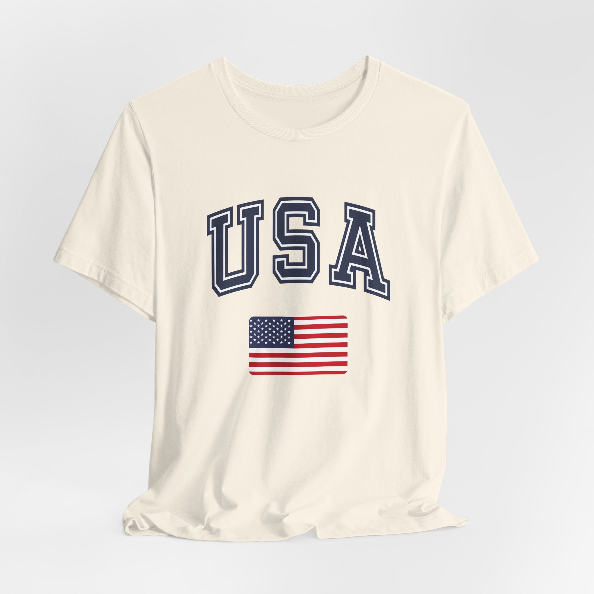 White t-shirt with 'USA' text and American flag on a light gray background