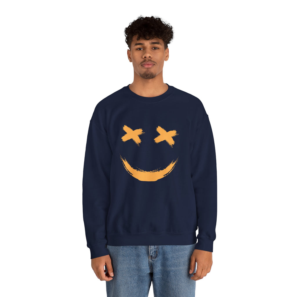 Person wearing a navy sweatshirt with a yellow smiley face design on a white background