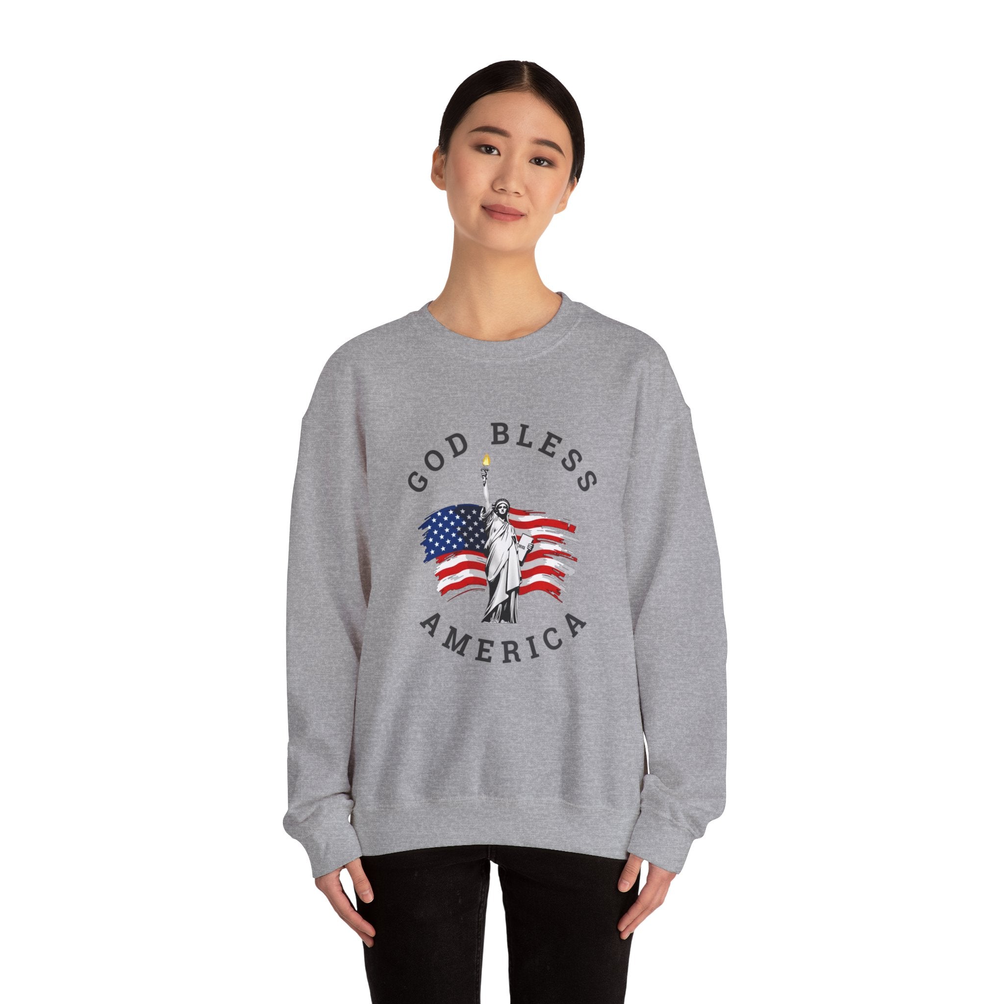 Person wearing a gray sweatshirt with 'God Bless America' graphic on a white background