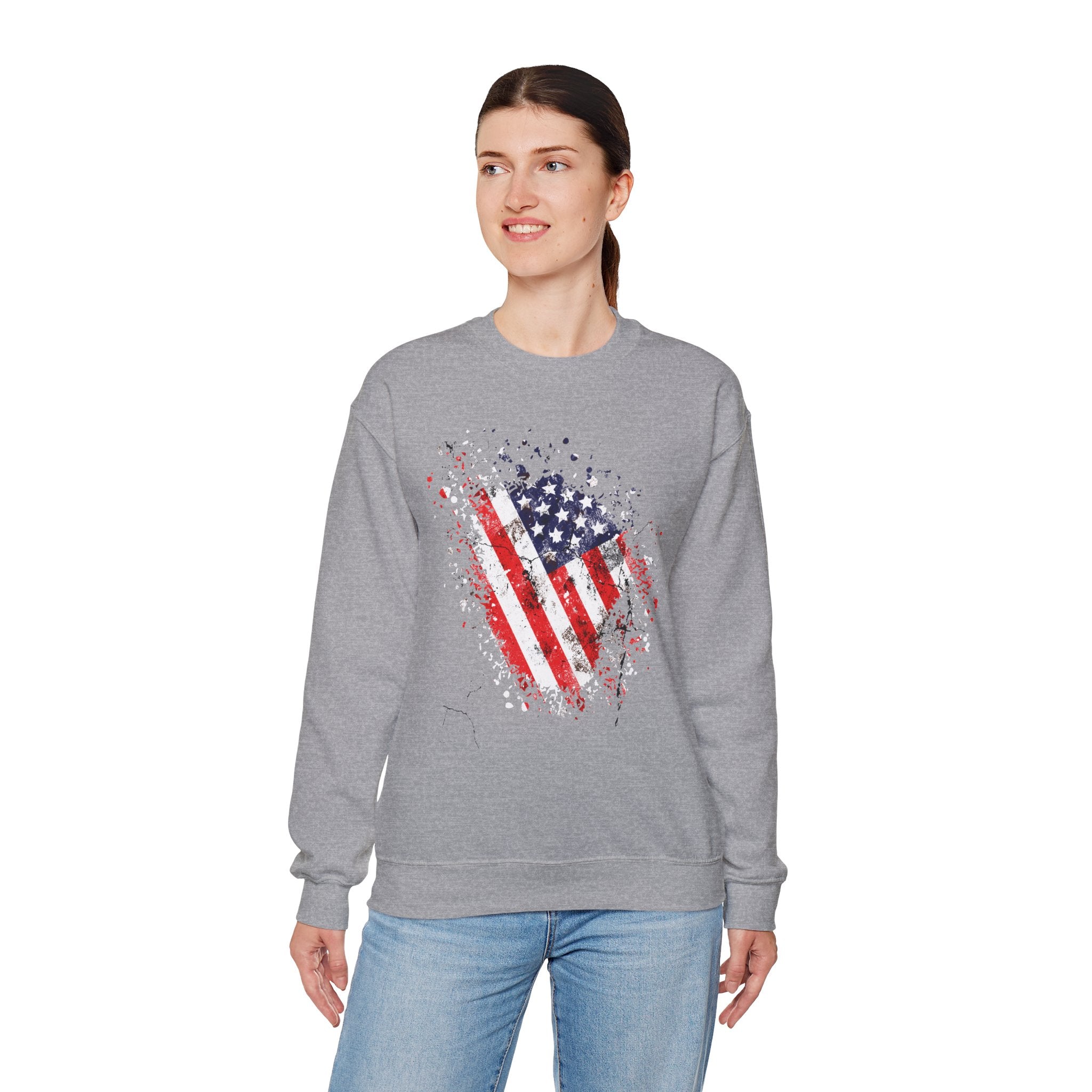 Woman wearing a gray sweatshirt with an American flag design on a white background