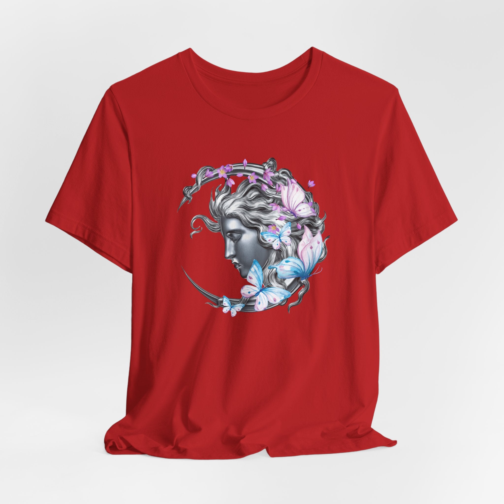 Red t-shirt with a graphic design of a woman's face with flowers and butterflies on a white background